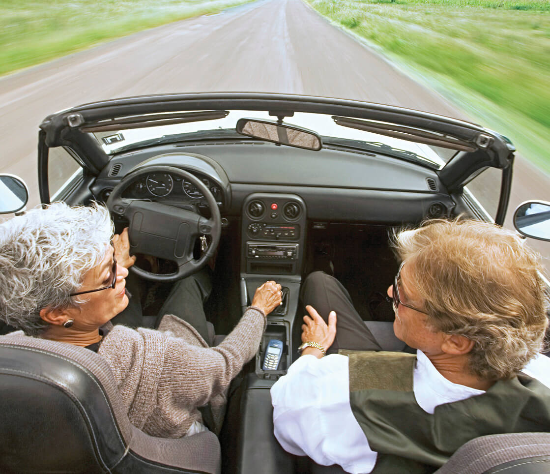 Photo of couple in a rental car