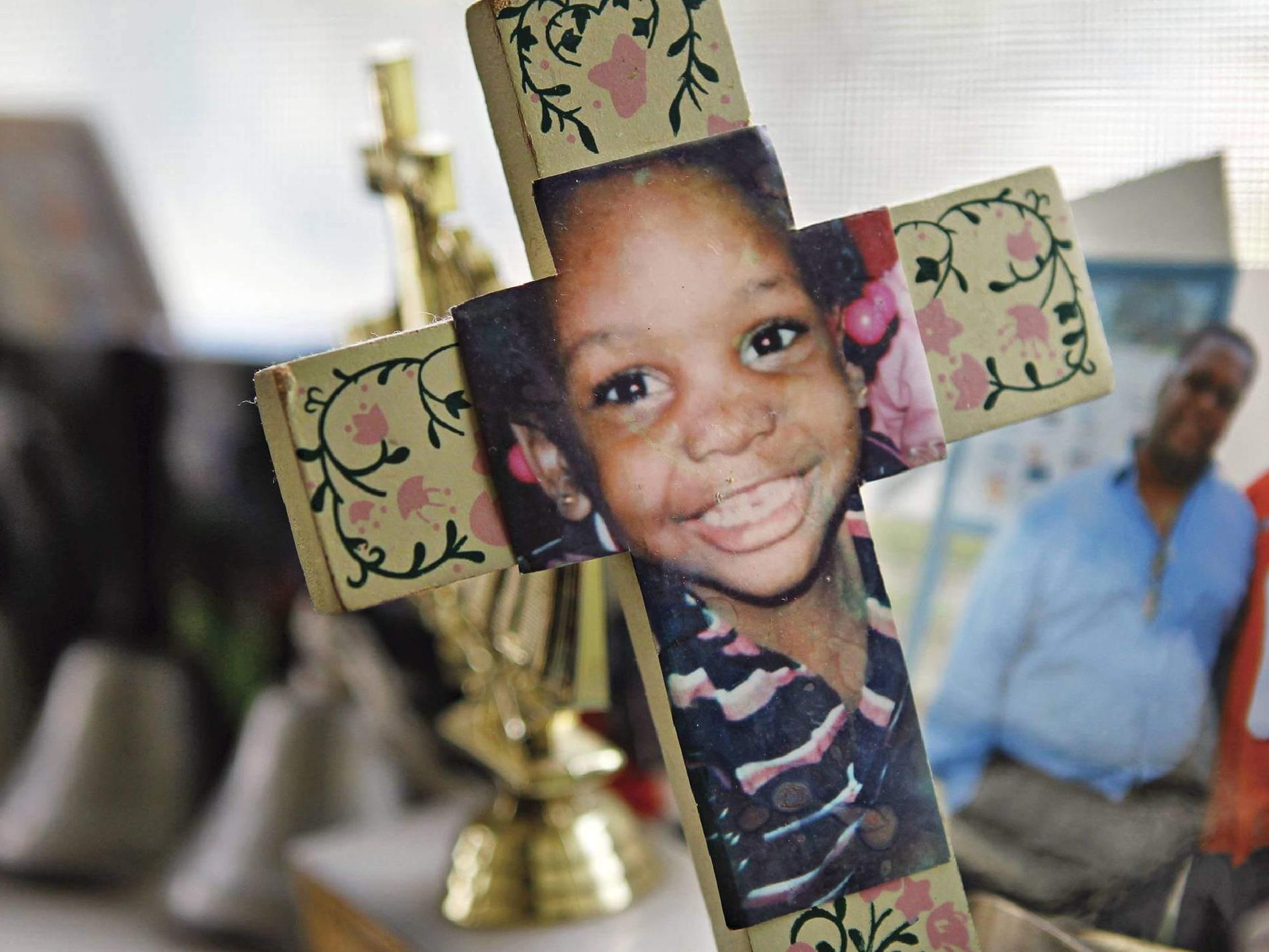 Photo of memorial cross of young girl