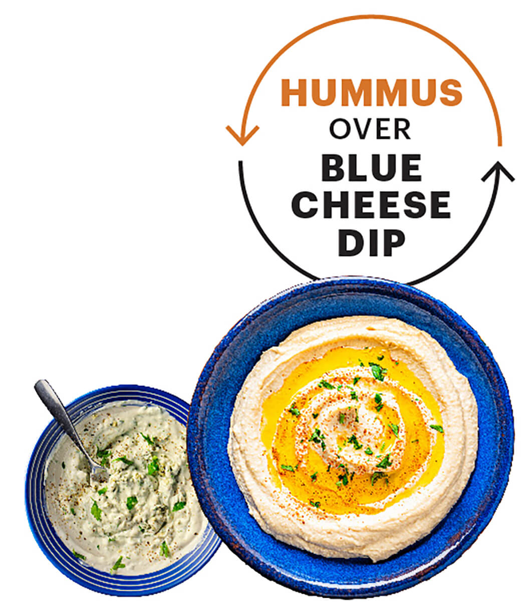 A plate of hummus next to a plate of blue cheese. A text bubble next to it reads Hummus over blue cheese