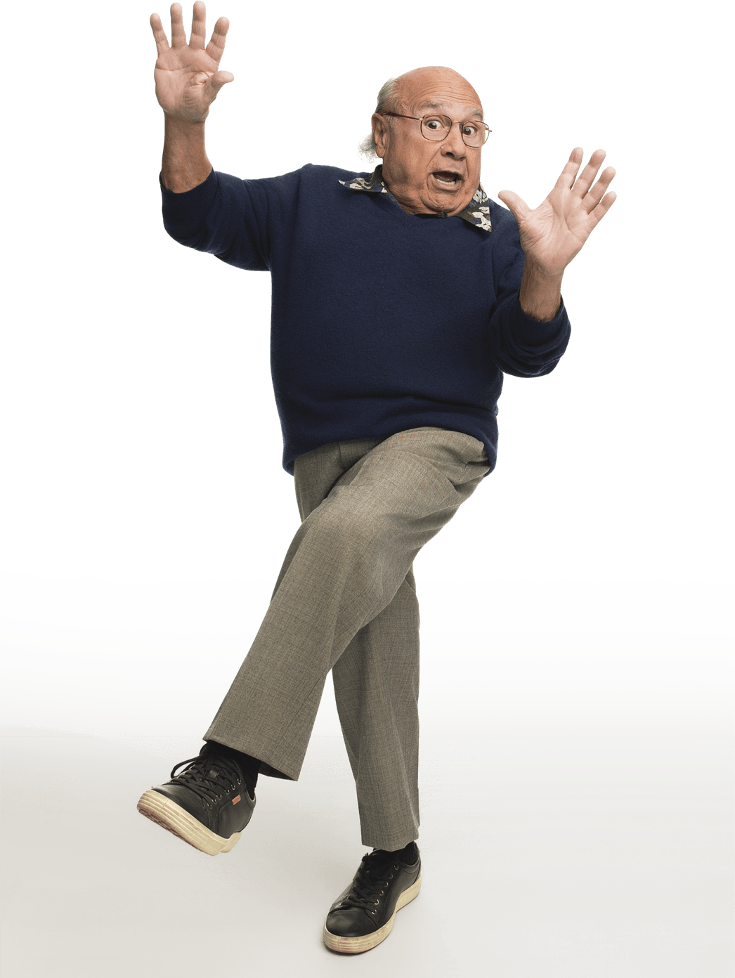 Photograph of him standing looking like he’s surprised