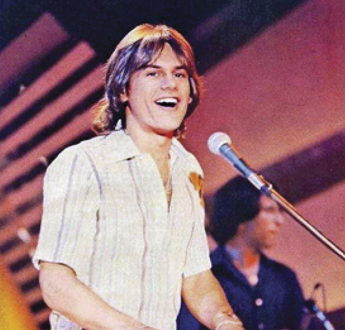 Photograph of younger Harry Wayne singing 