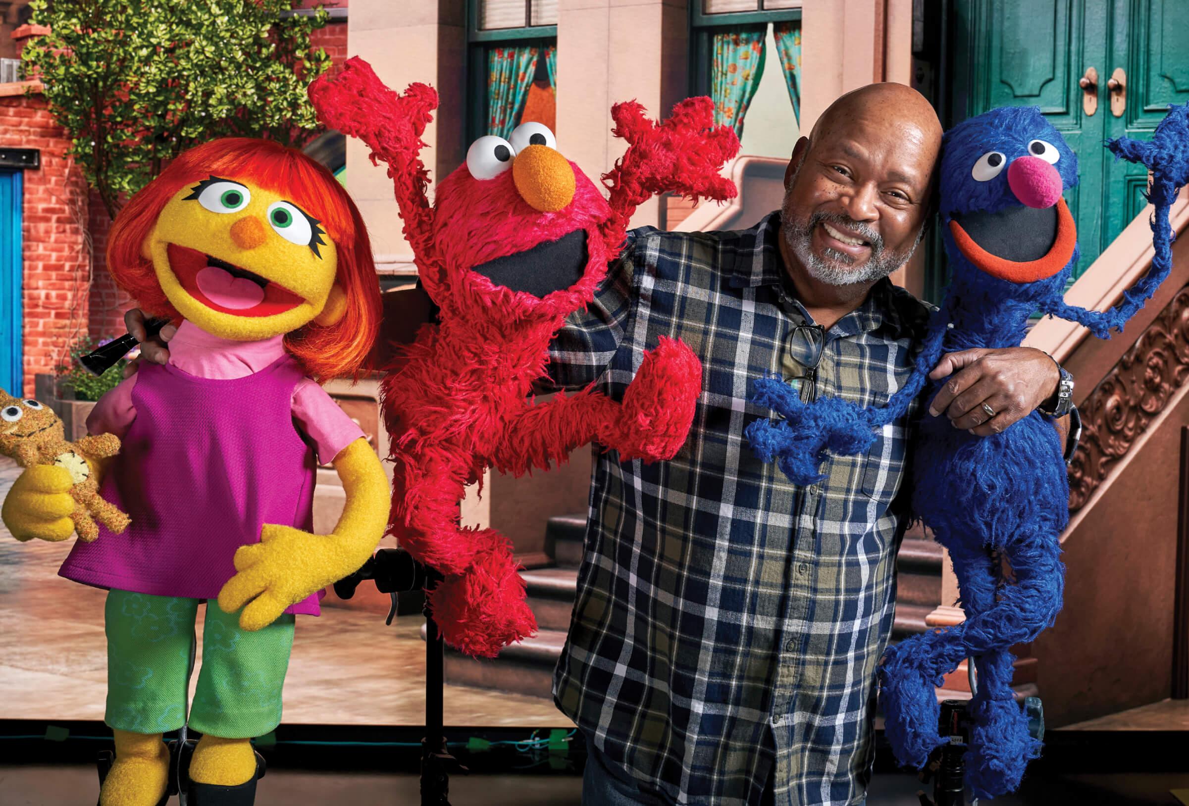 Photograph of a Mitchell with the Sesame Street puppets