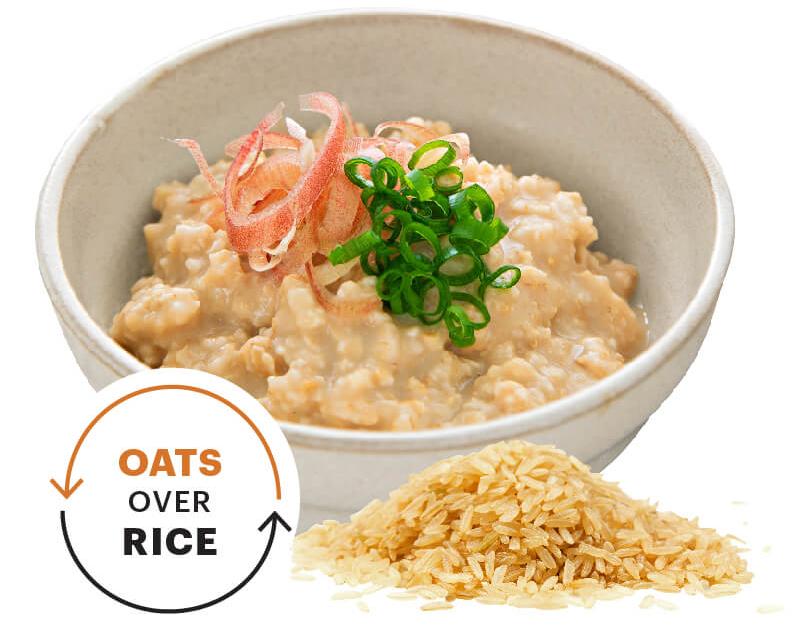 A bowl of oats next to a pile of uncooked rice. A text bubble that says Oats over rice