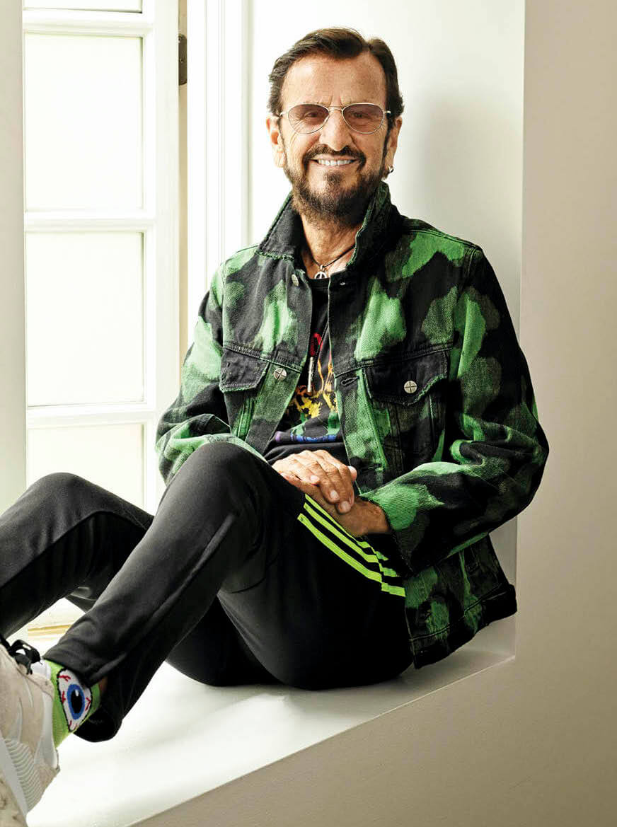 Photo of Ringo Starr sitting on a window sill