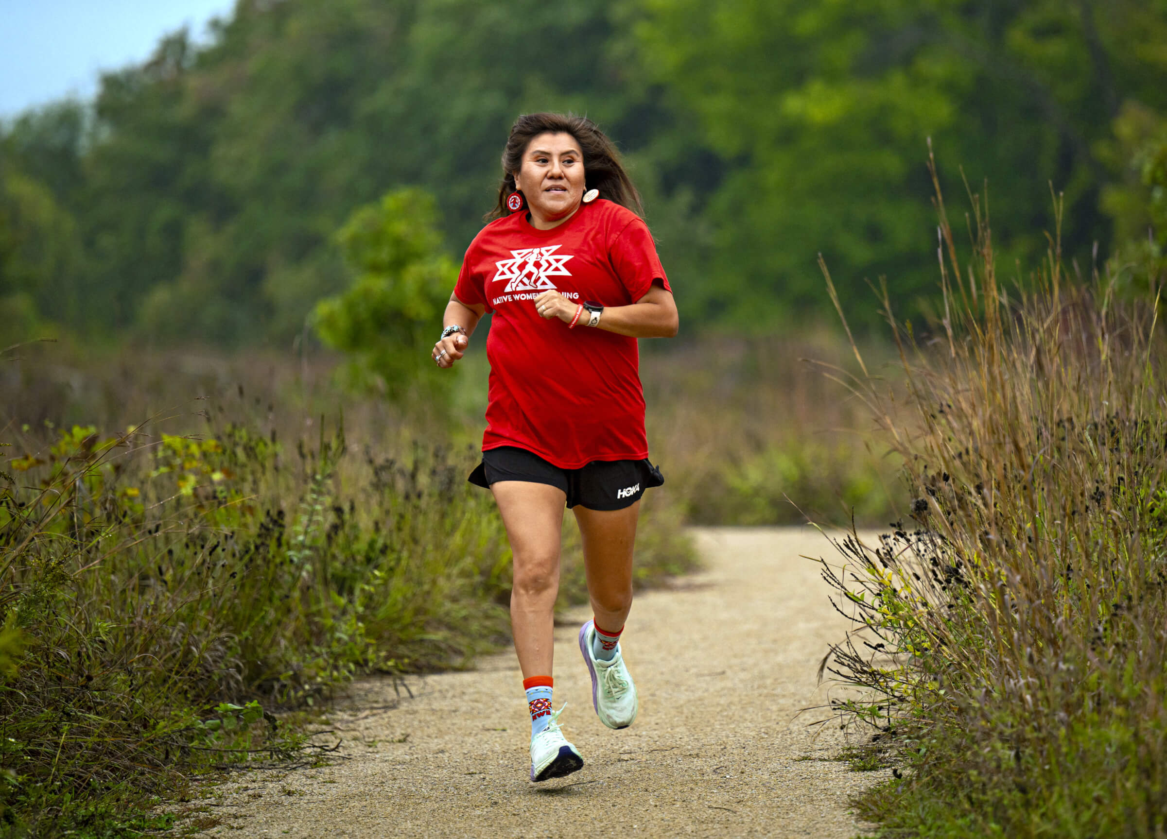 Photo of Verna NezBegay Volker running on a trail