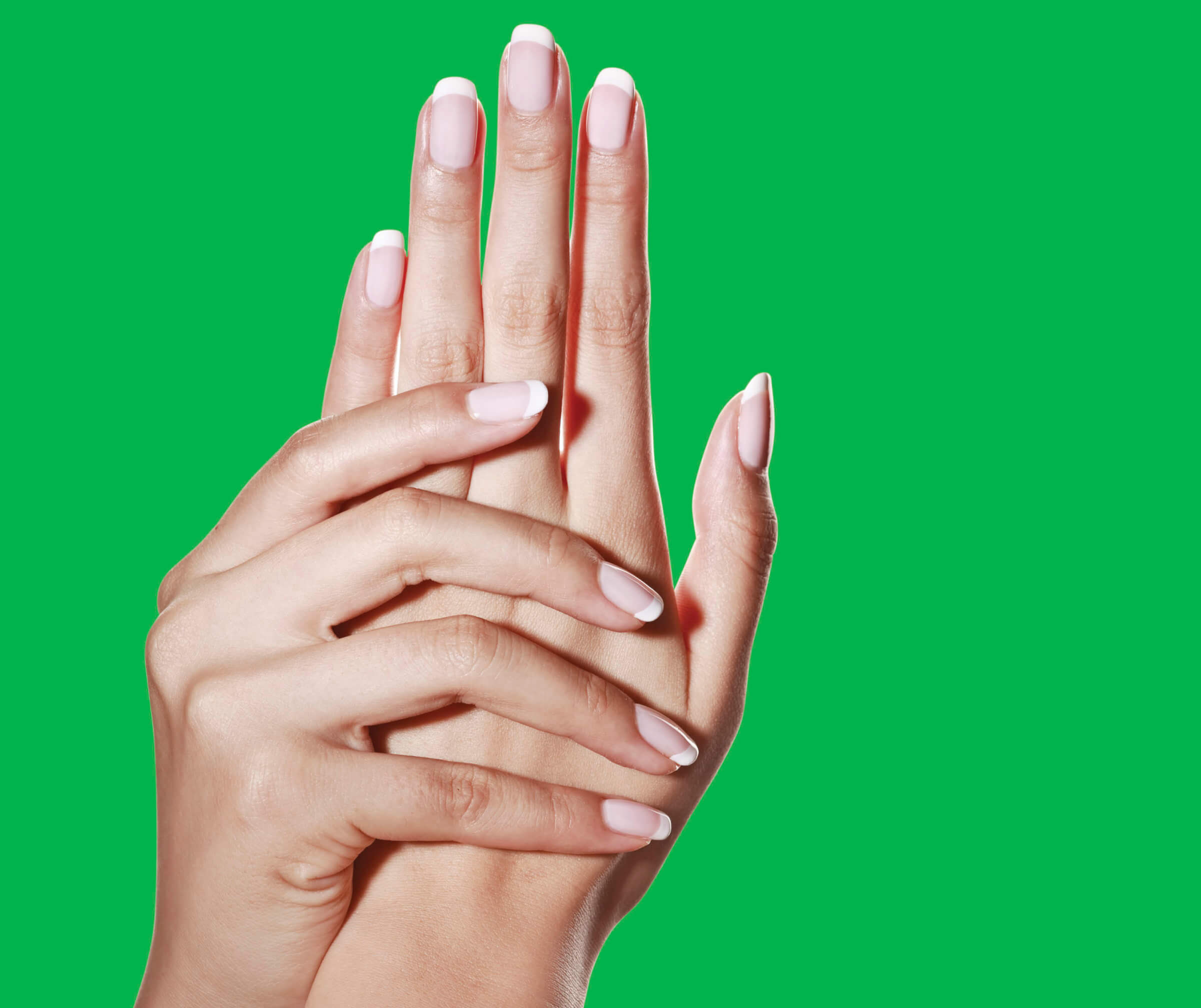 Photo of a woman's hands showing her beautifully manicured nails