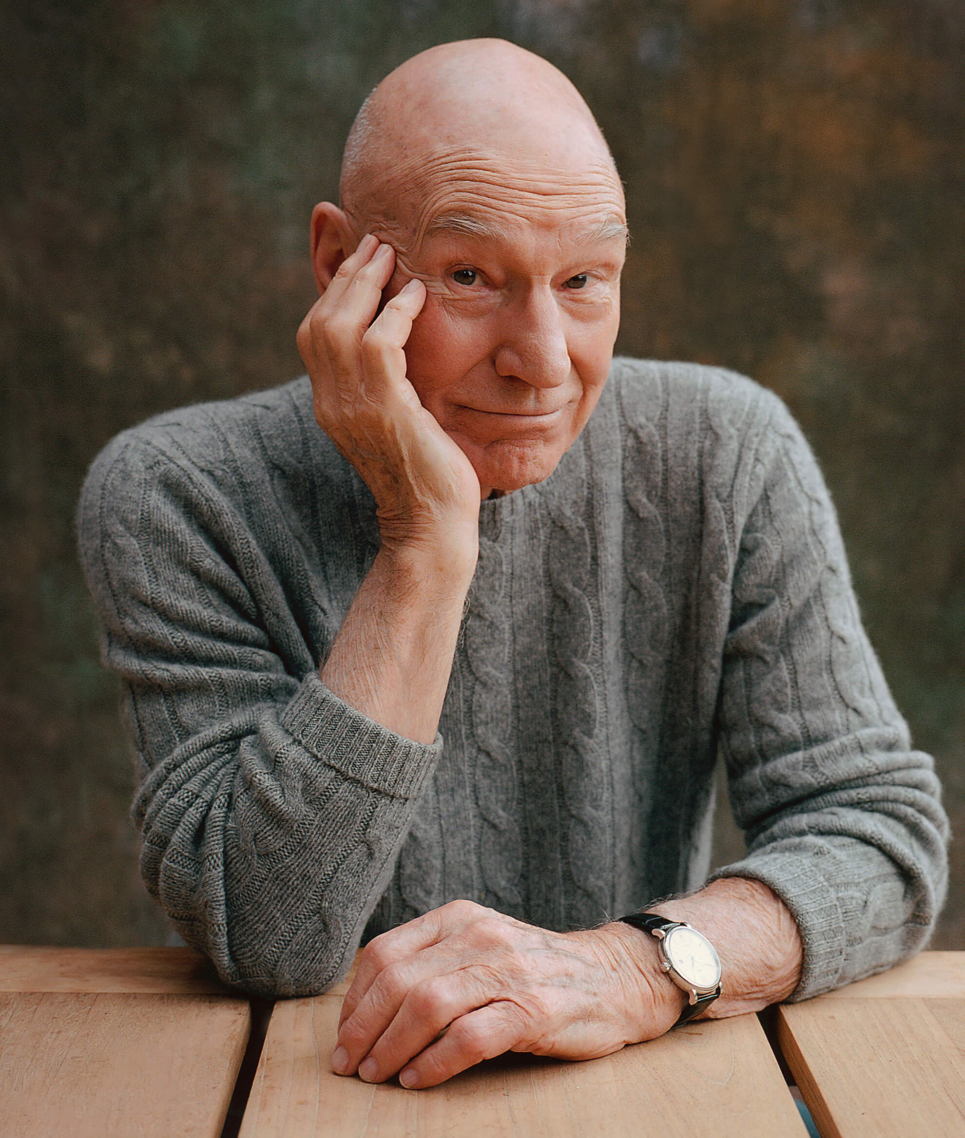 Photo of Sir Patrick Stewart resting his head on his right palm