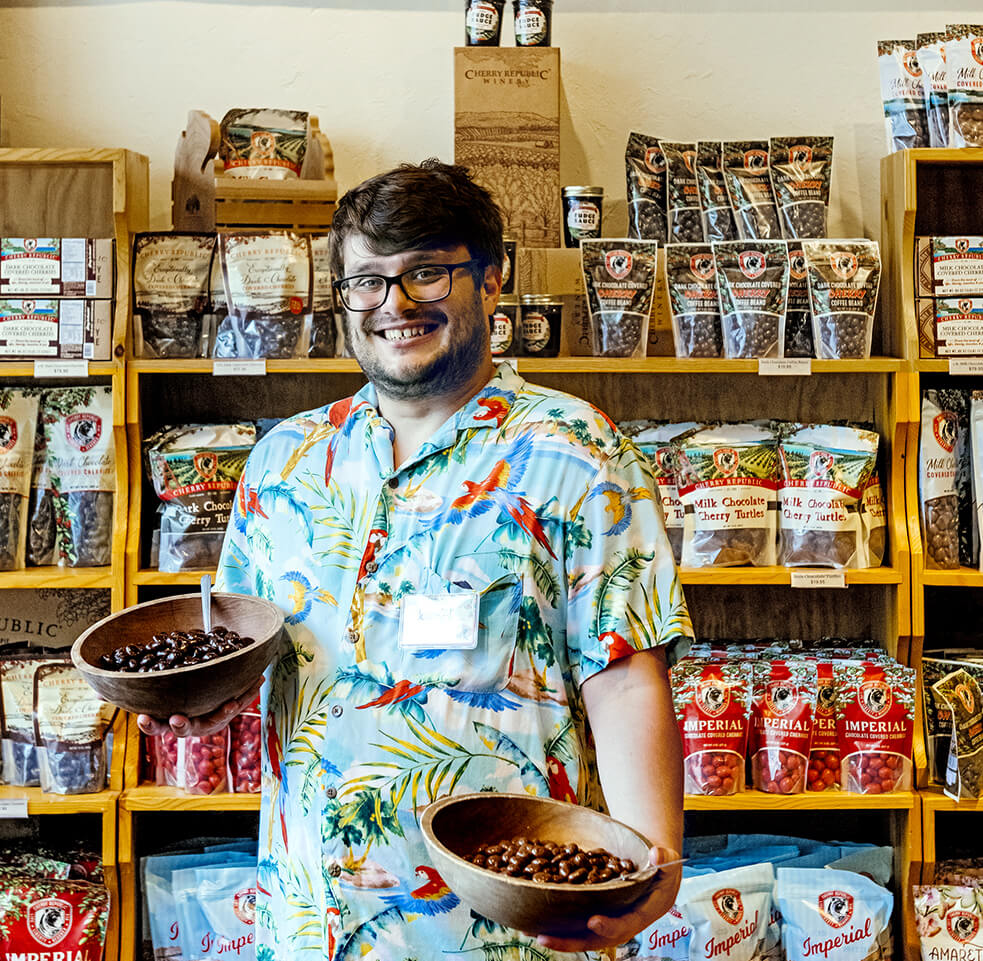 Photo of a happy shop worker at Cherry Republic in downtown Traverse City