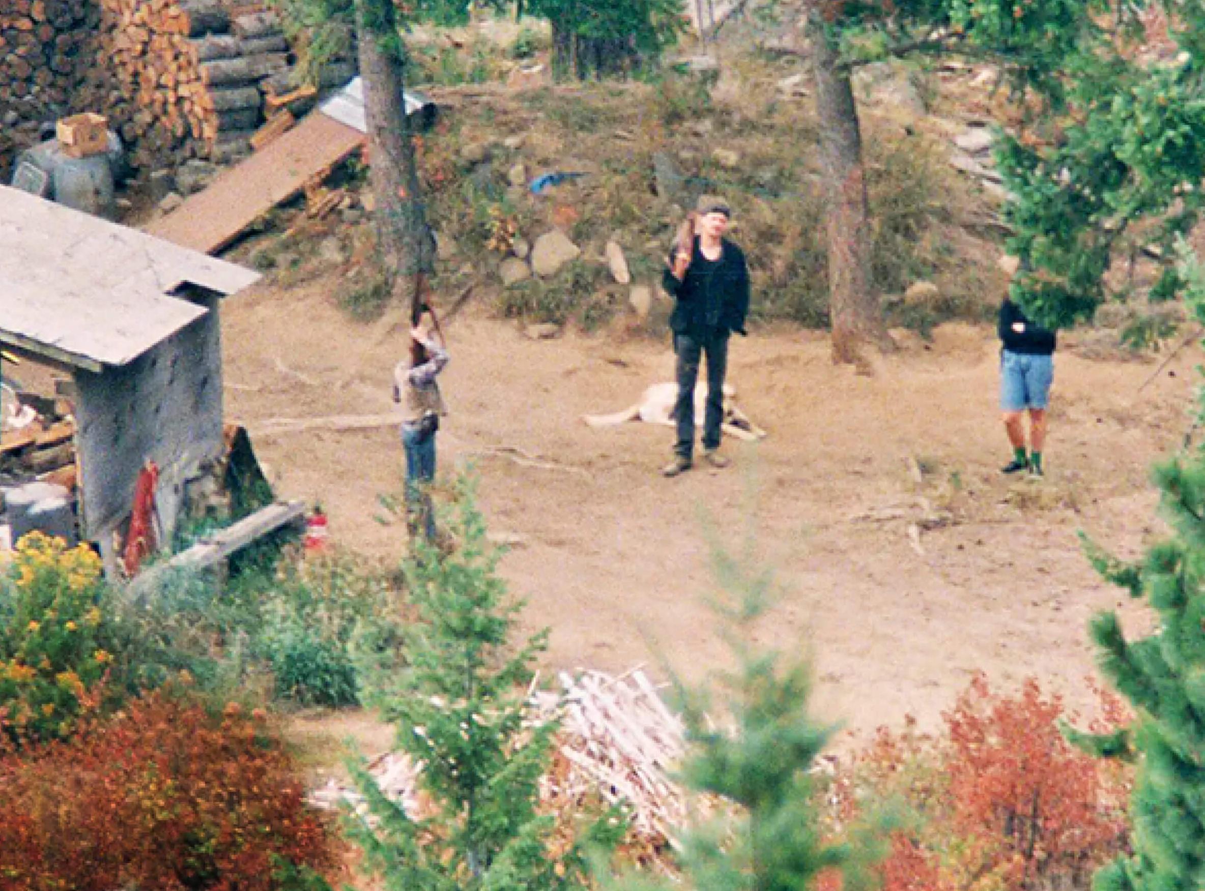 Photo of the Weavers standing outside their home during the Ruby Ridge shootout in 1992