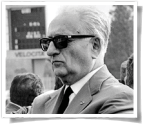 Black and white photo of Enzo Ferrari