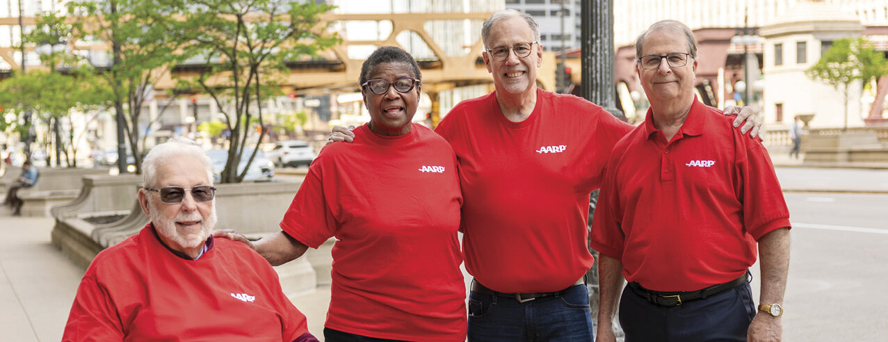 Photograph of several AARP volunteers together wearing AARP shirts 