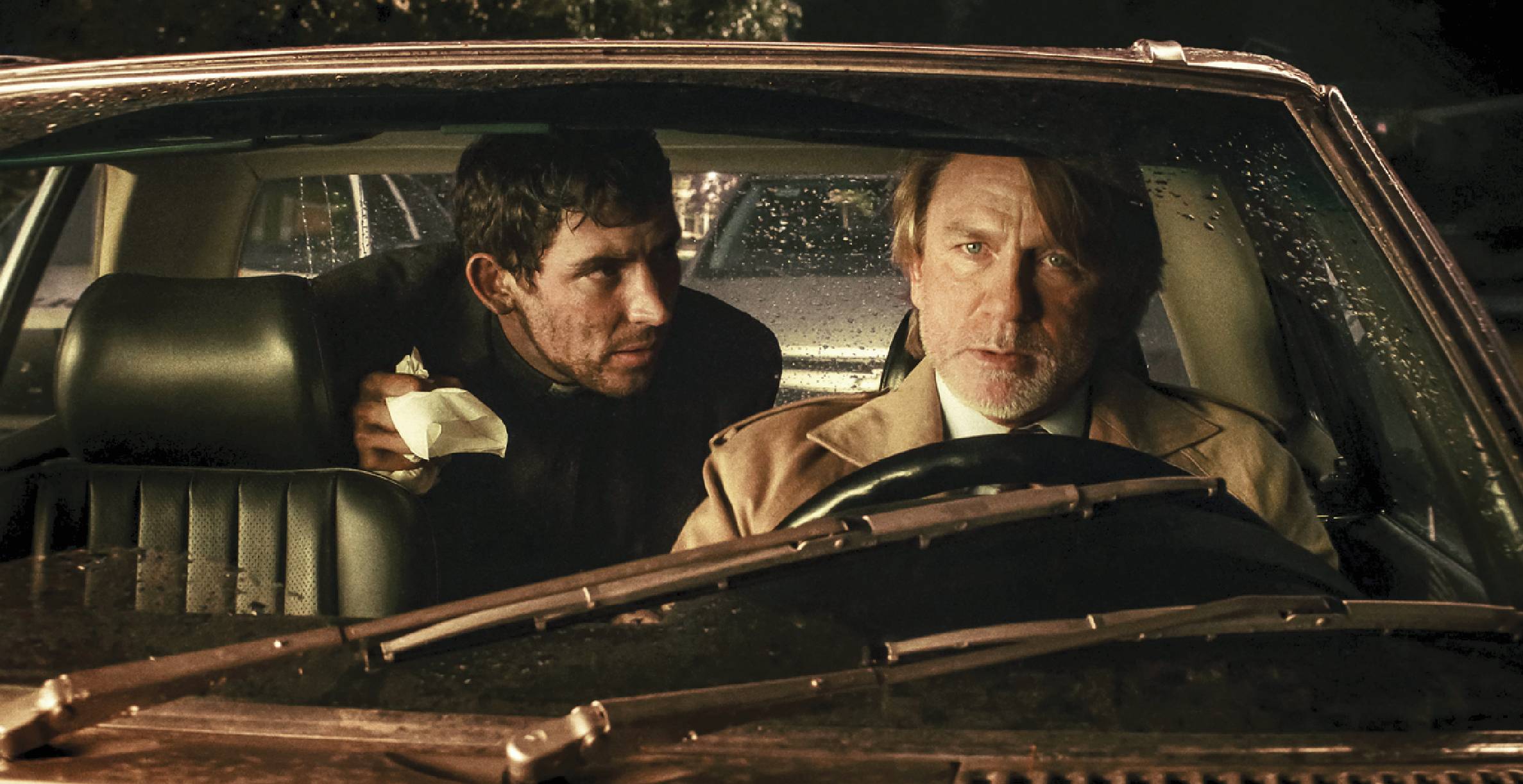 Scene of two actors in a car from the movie Wake Up Dead Man