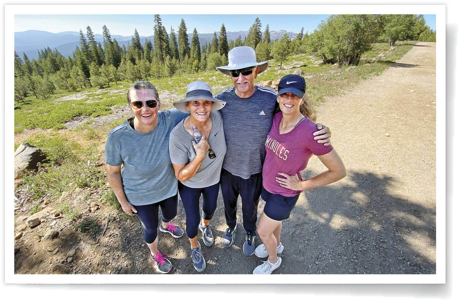 Photograph of Kristen Maxwell with her family on a hike 