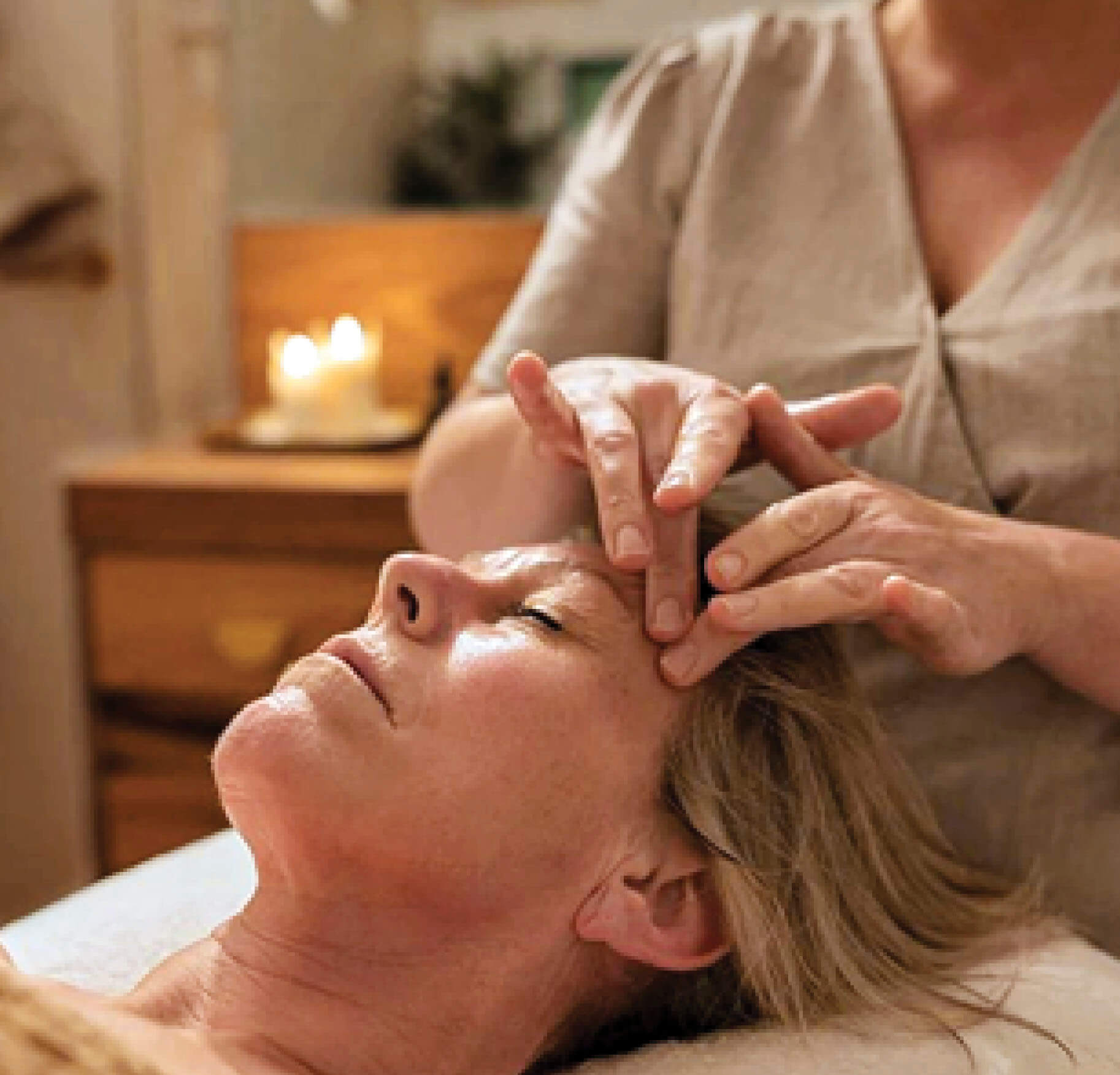 Photo of a woman getting a facial massage 
