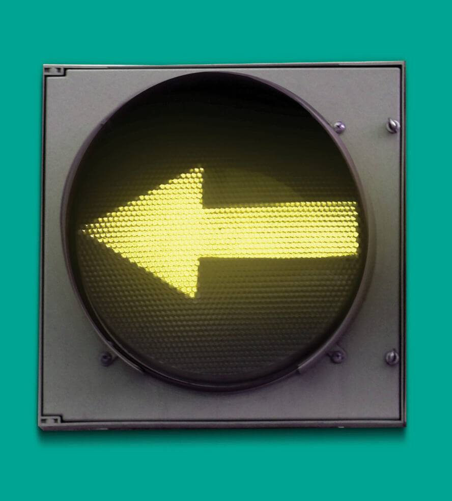 Traffic light box that has a yellow arrow pointing left
