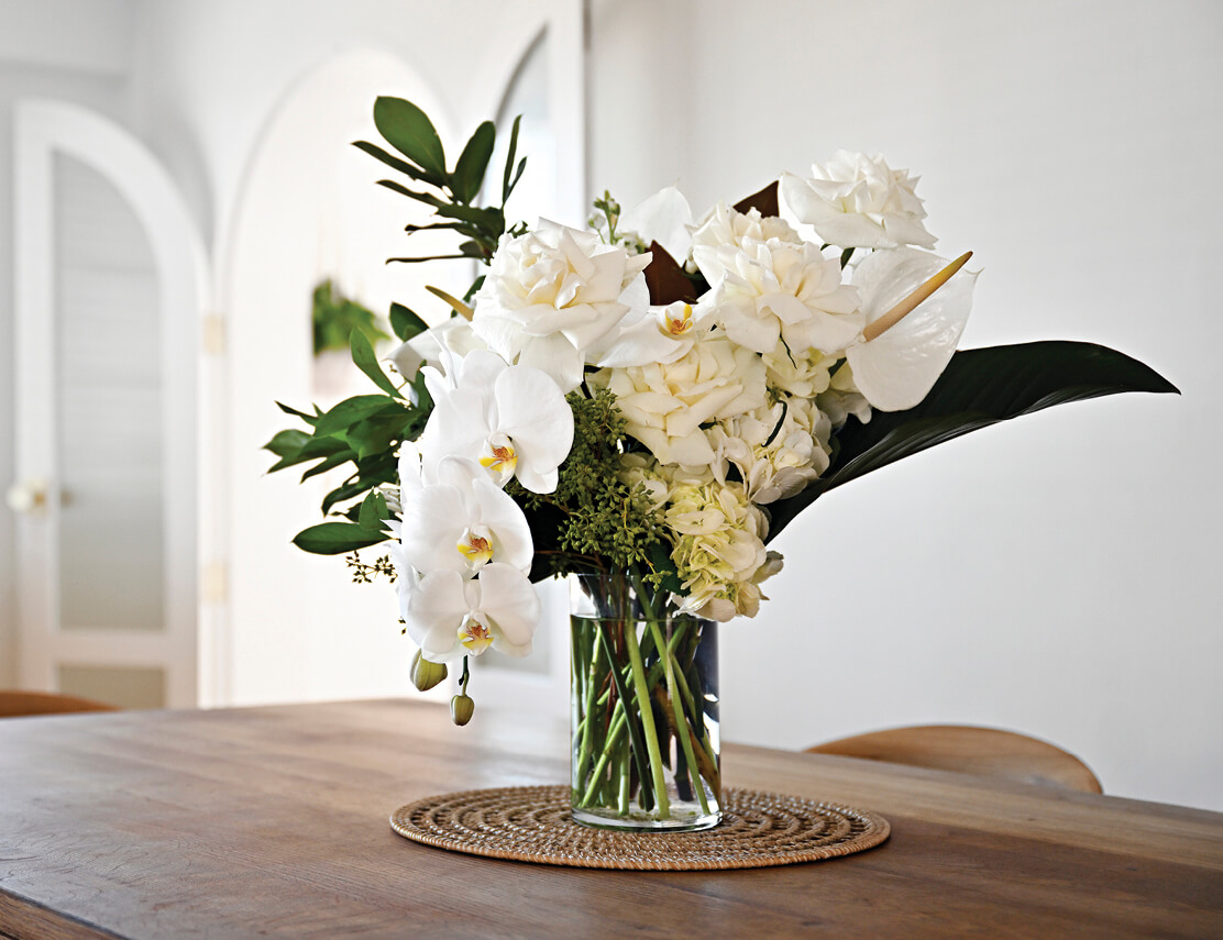 Photo of a floral arrangement on table