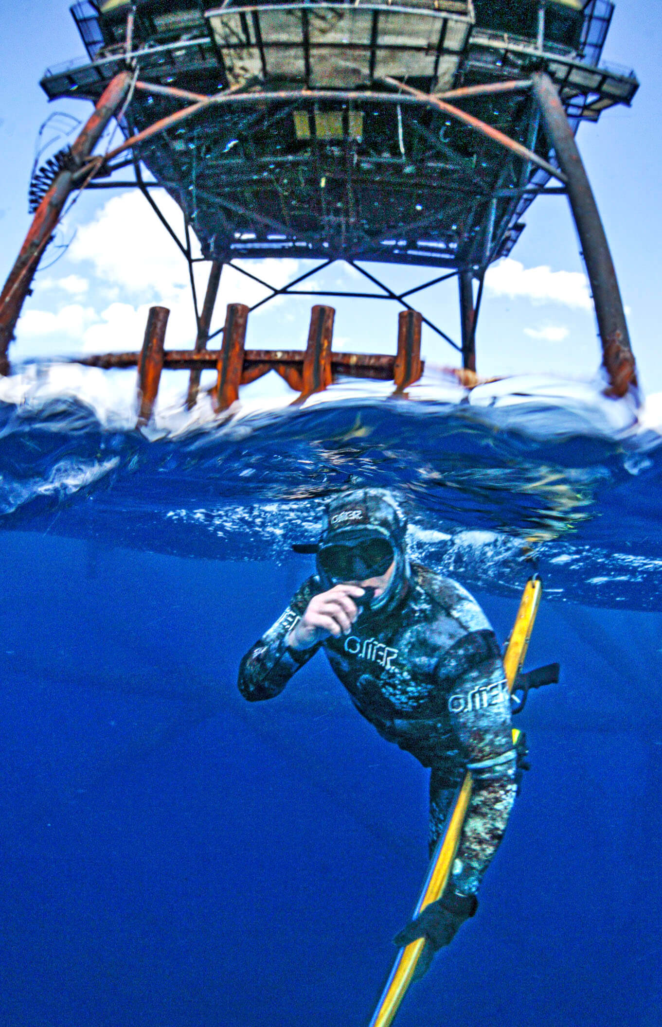 Photo of Neal diving below tower