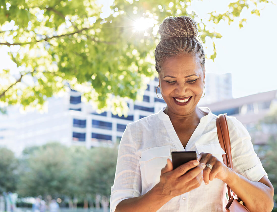 Photo of a woman looking at her cell phone