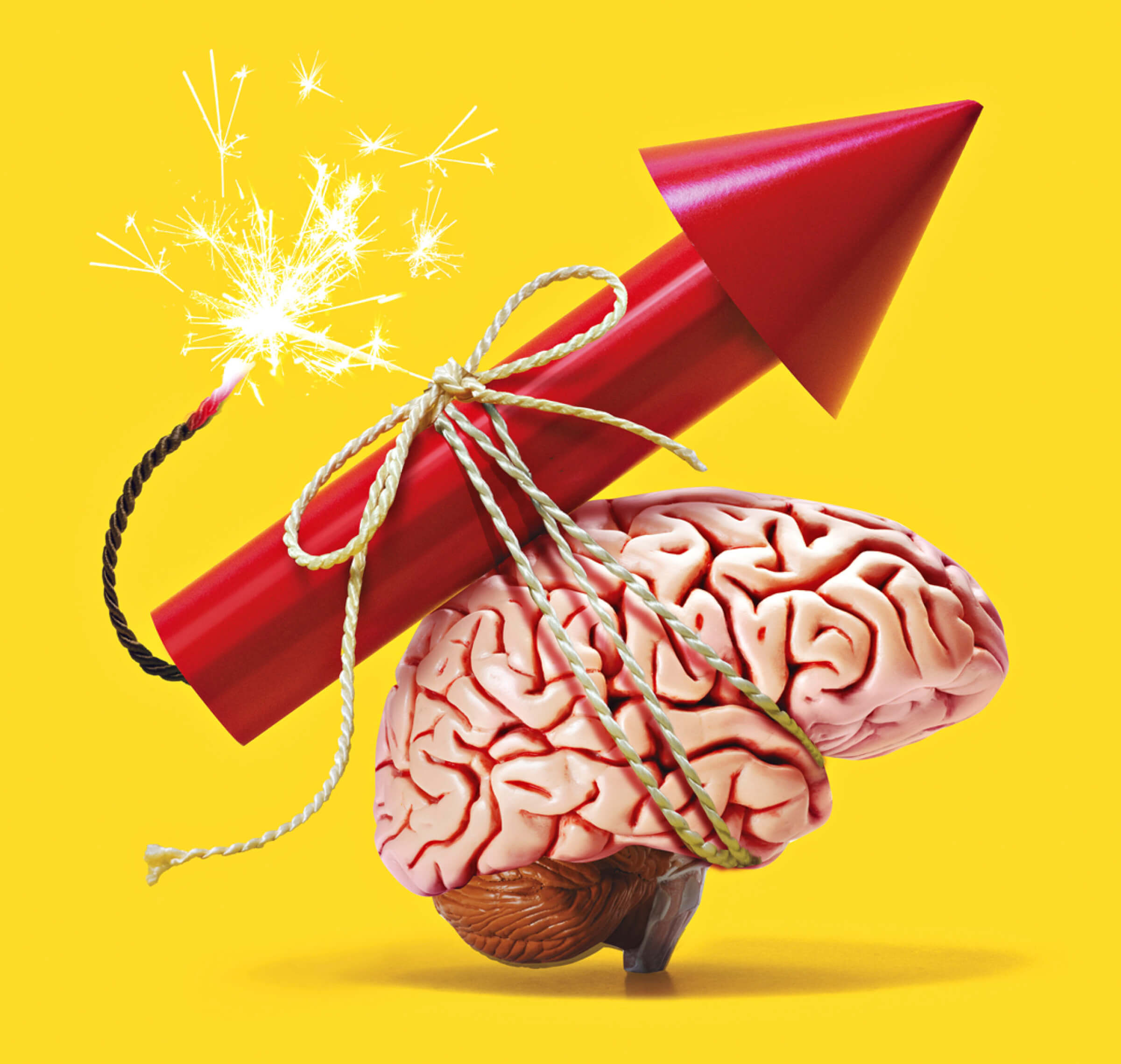 Photo illustration of a brain with a dynamite arrow strapped to it