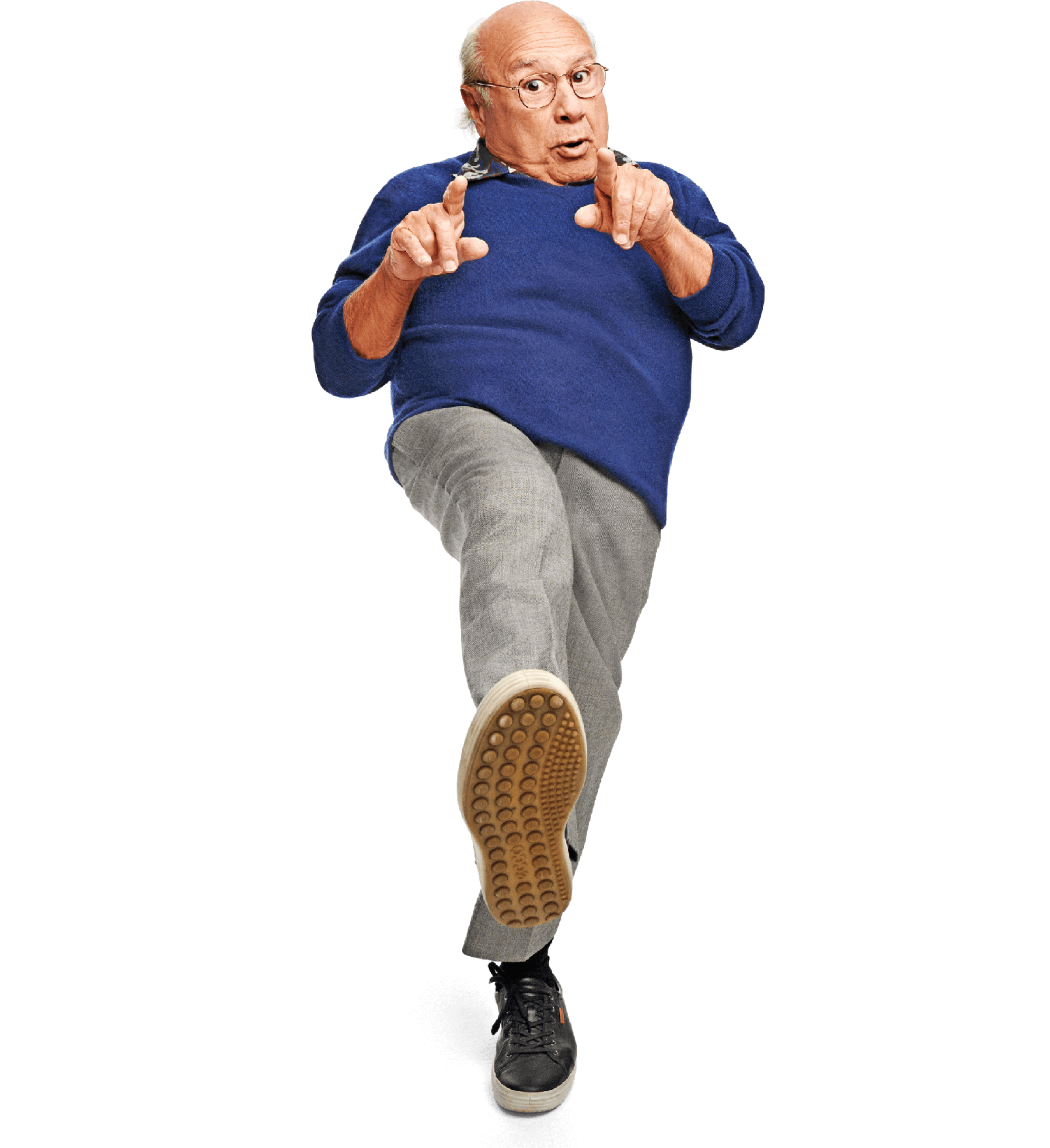Photo of Danny DeVito kicking a foot in the air