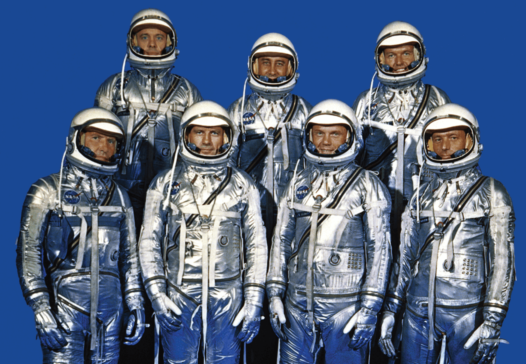 Vintage color photo of a group of NASA astronauts in silver space suits