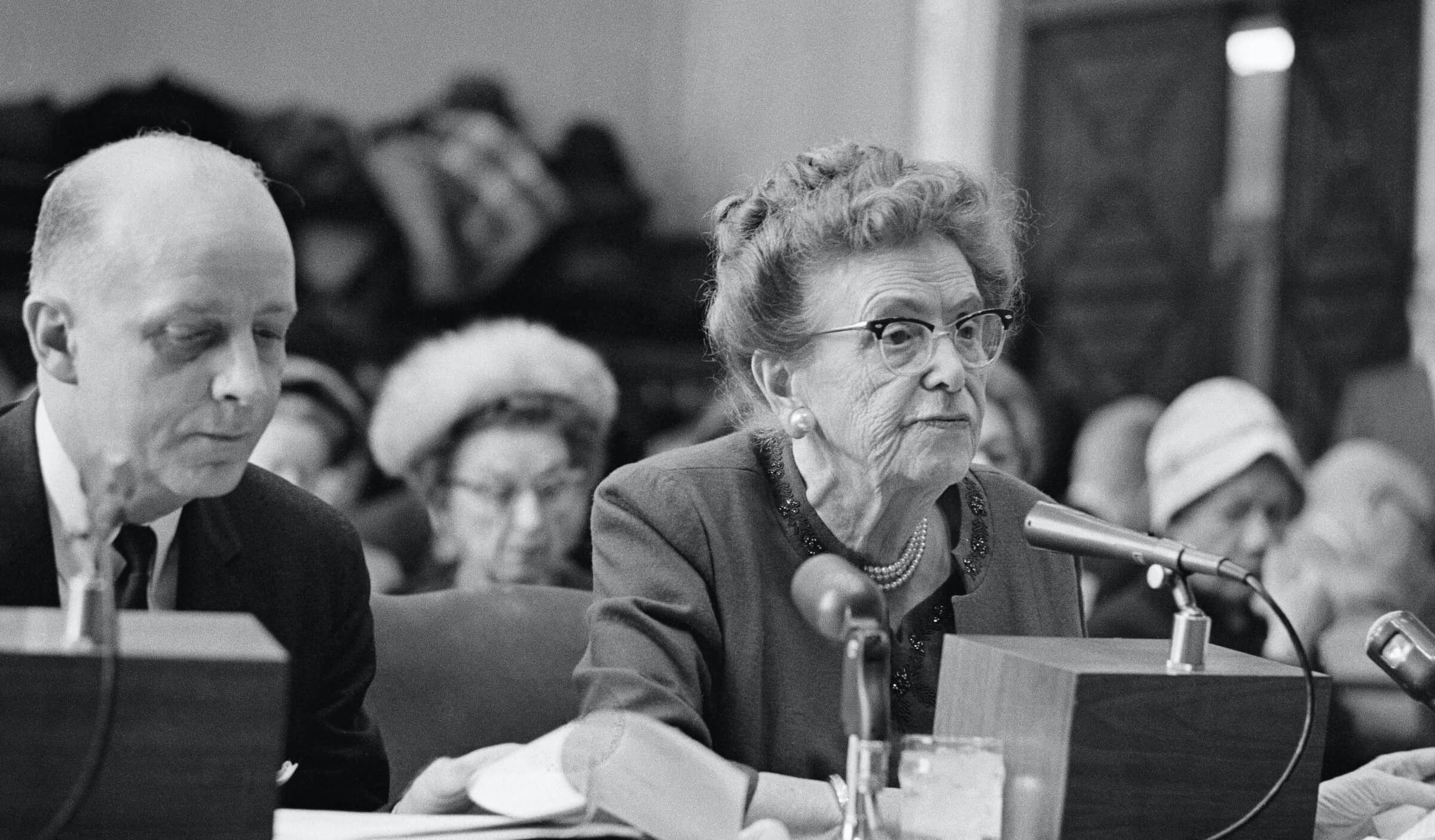 Vintage black and white photo of an AARP-sponsored Crime and Safety program hearing