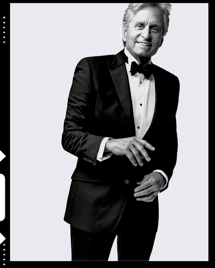 Black and white photo of Michael Douglas wearing a tuxedo