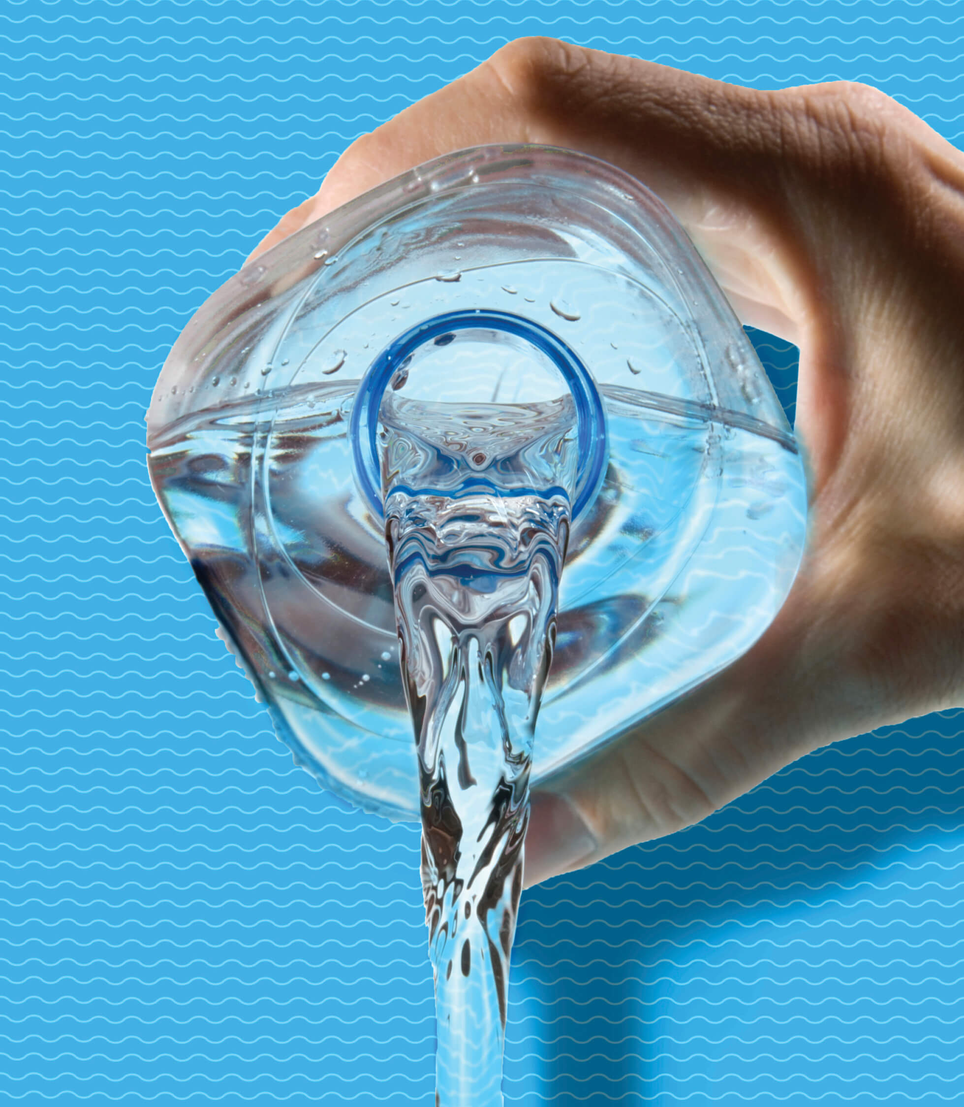 Photo of a hand pouring out a plastic water bottle