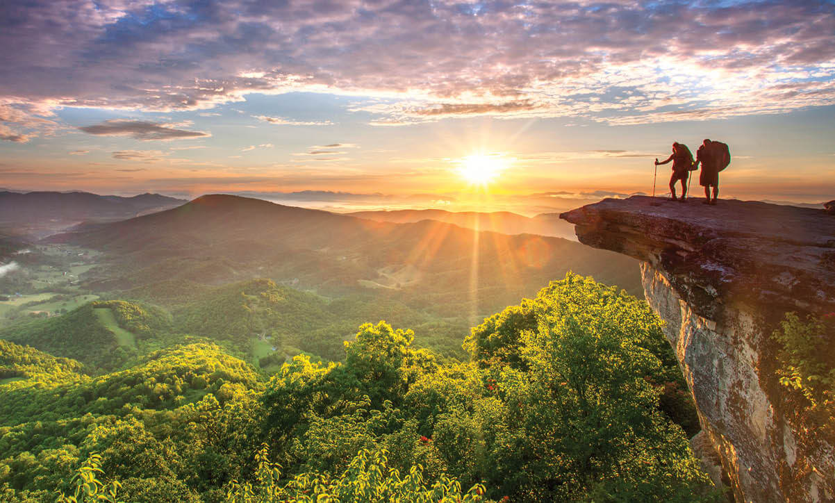 Photo of hikers looking out over the Appalachian Mountains