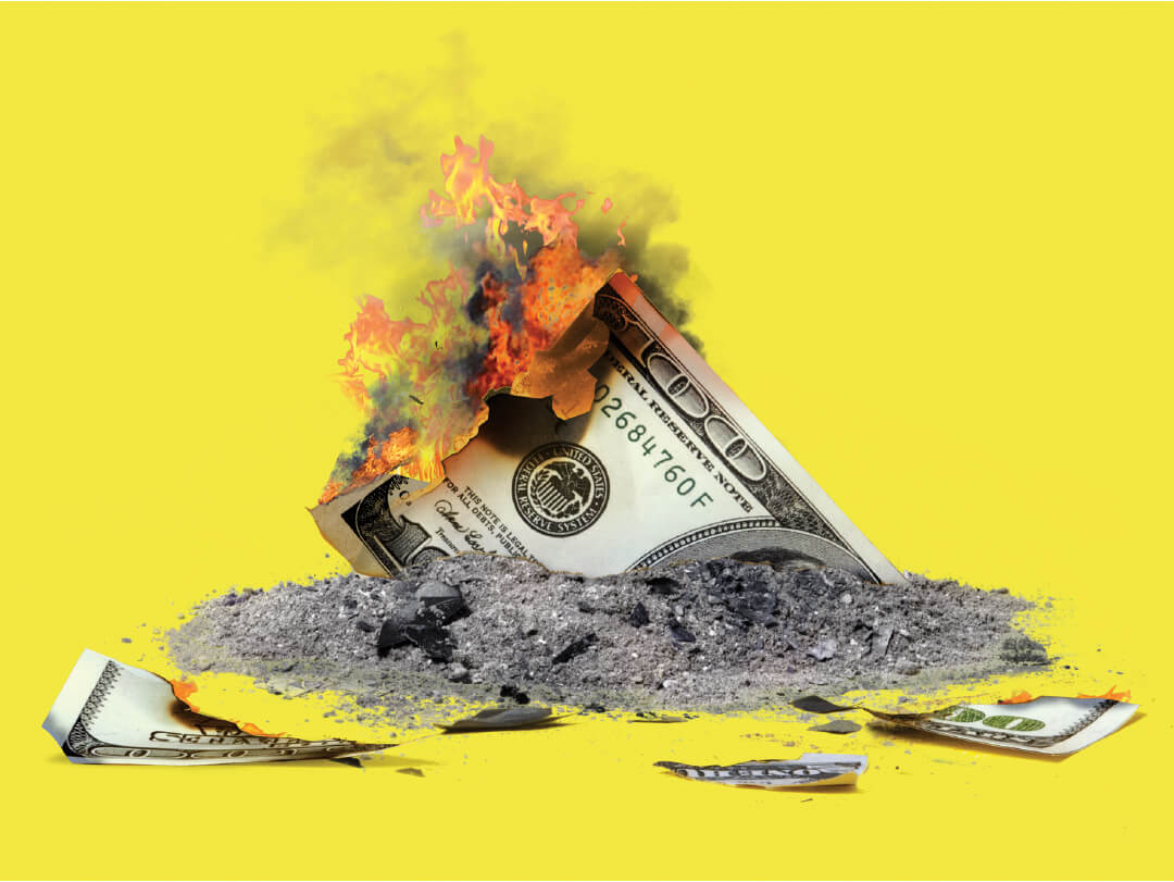Photo illustration of a 100 dollar bill on fire