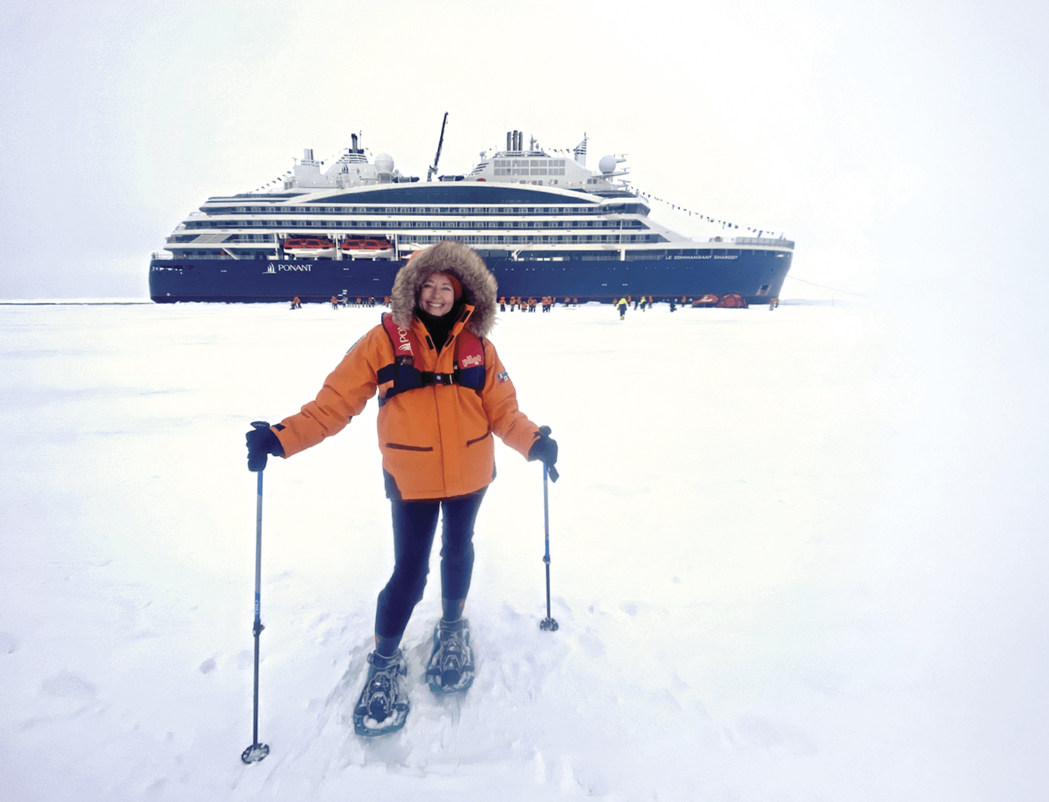 Photograph of Belinda Luksic standing in snow in front of a cruise ship&nbsp;