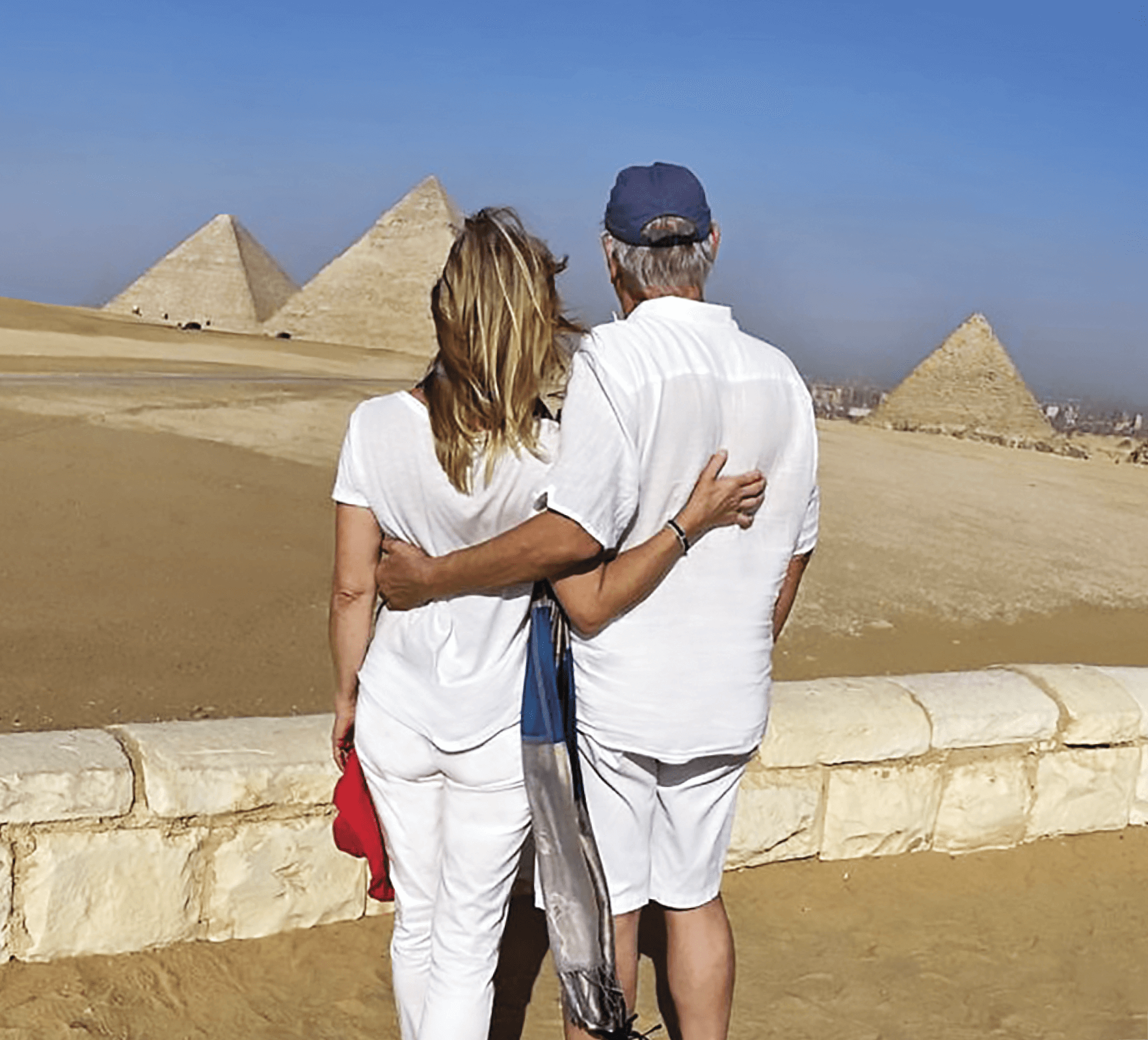 Rudi Schreiner with his wife Kristin standing in front of pyramids&nbsp;