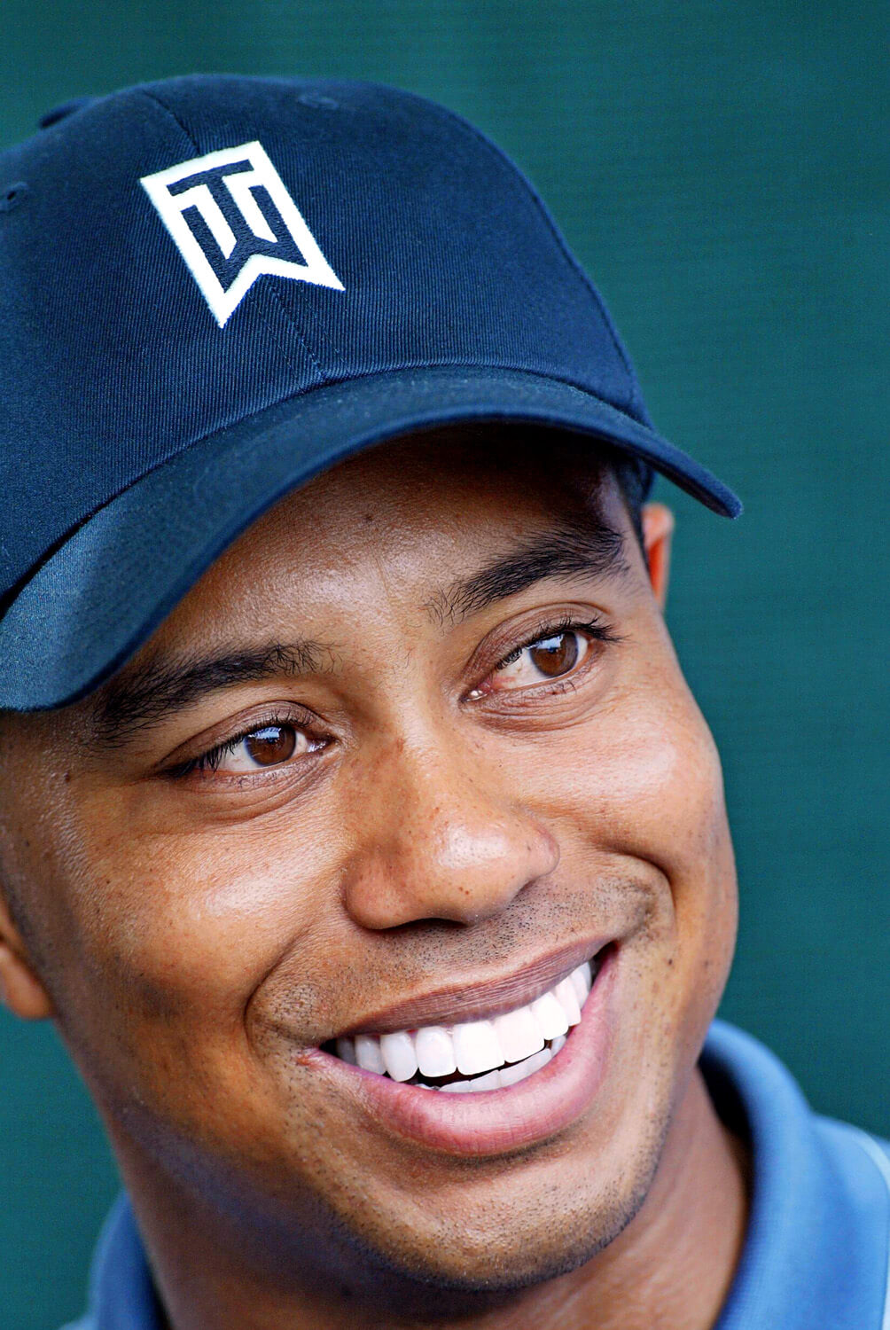 Photo of Tiger Woods smiling.