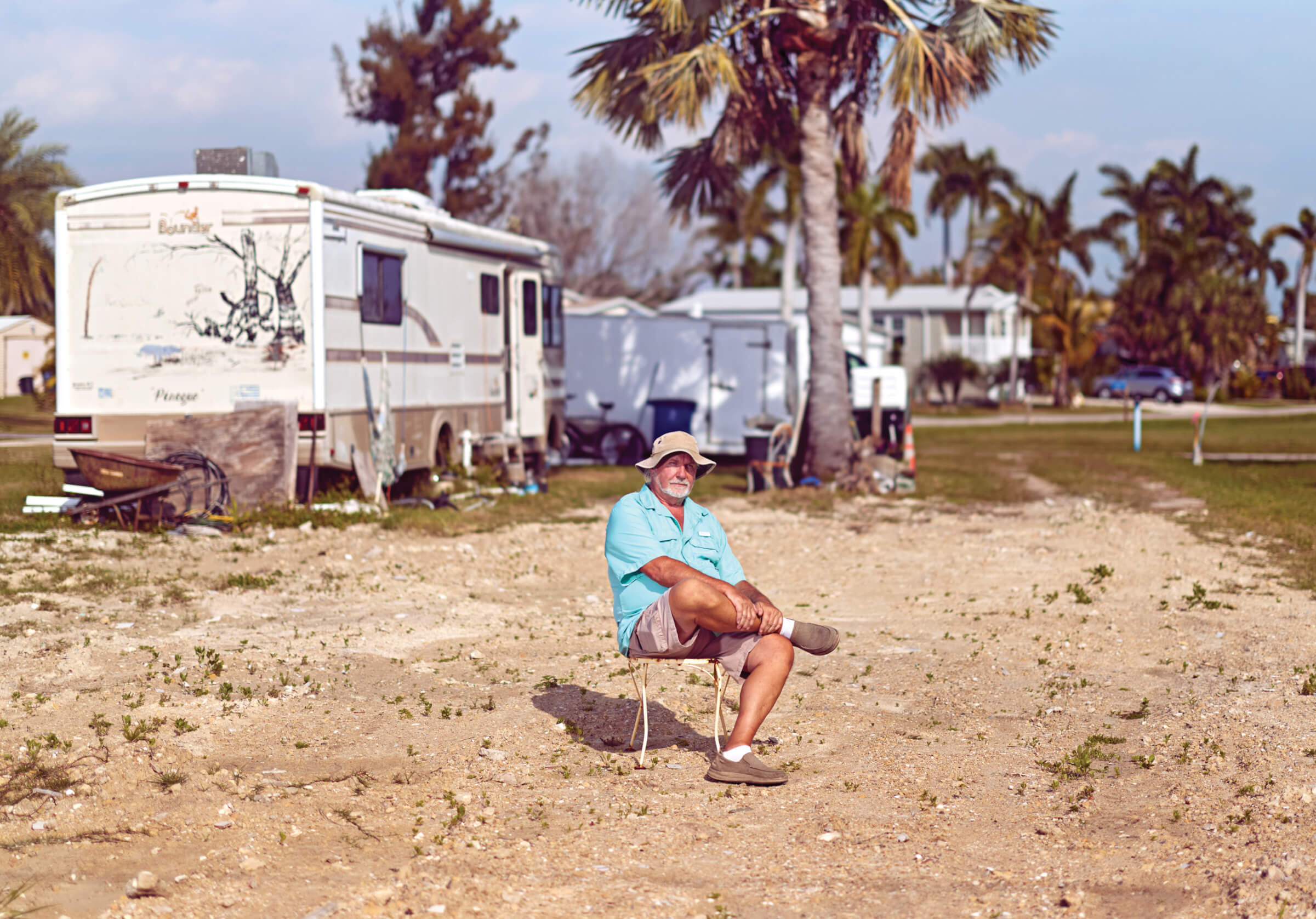 Photo of Joe Prigun on the plot where his home formerly stood