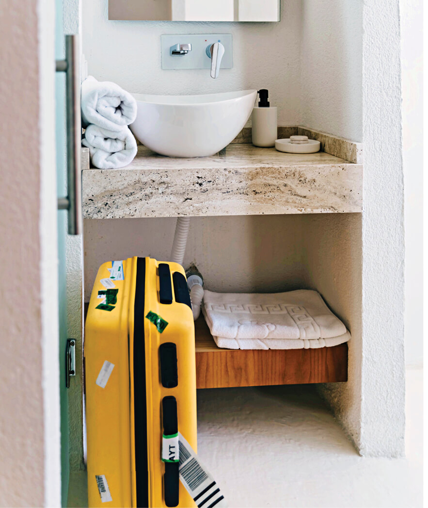 Photo of suitcase in bathroom