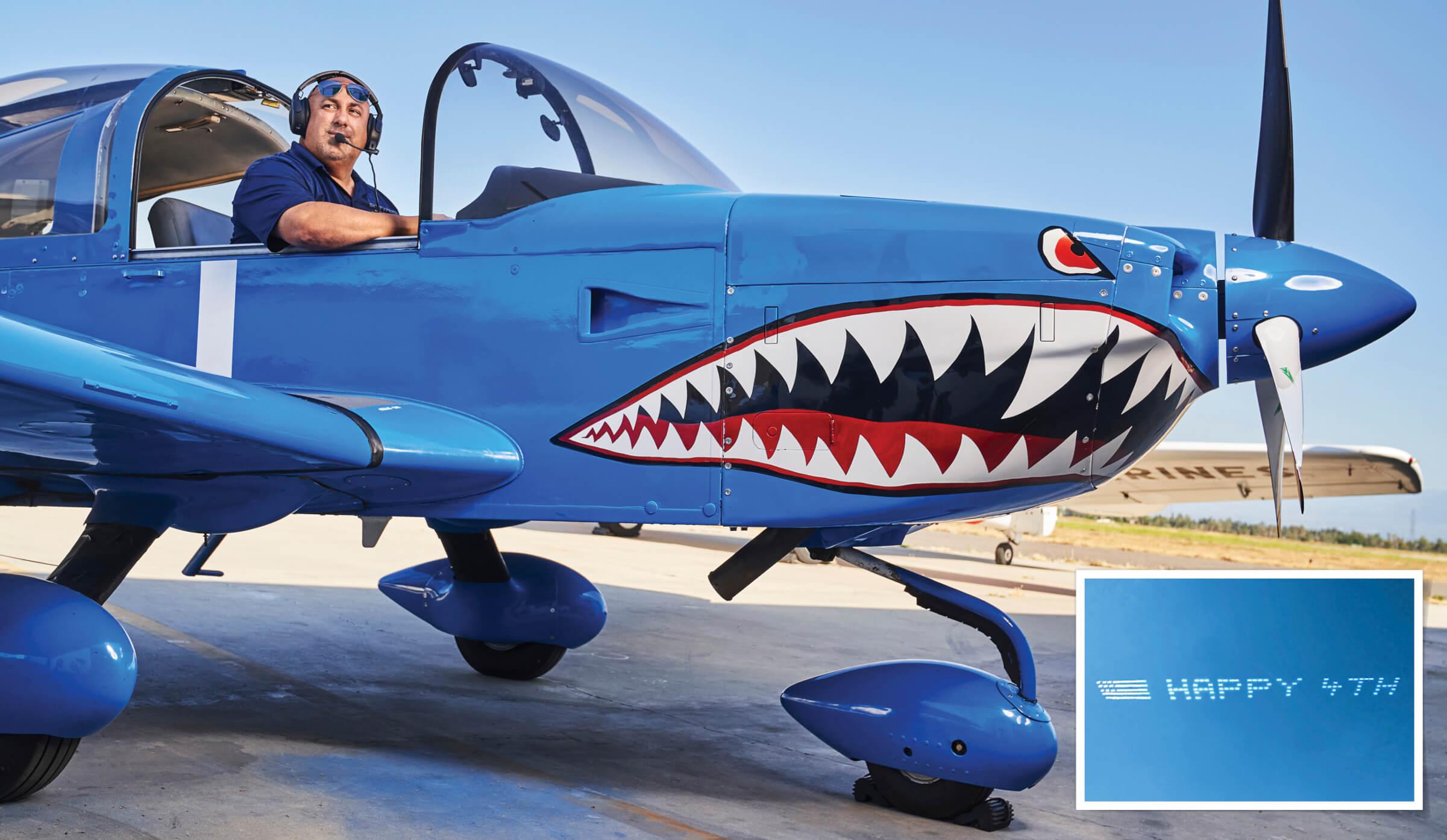 Photo of Stephen Stinis in airplane with shark face painted on the front, Image of skywriting that says HAPPY 4TH