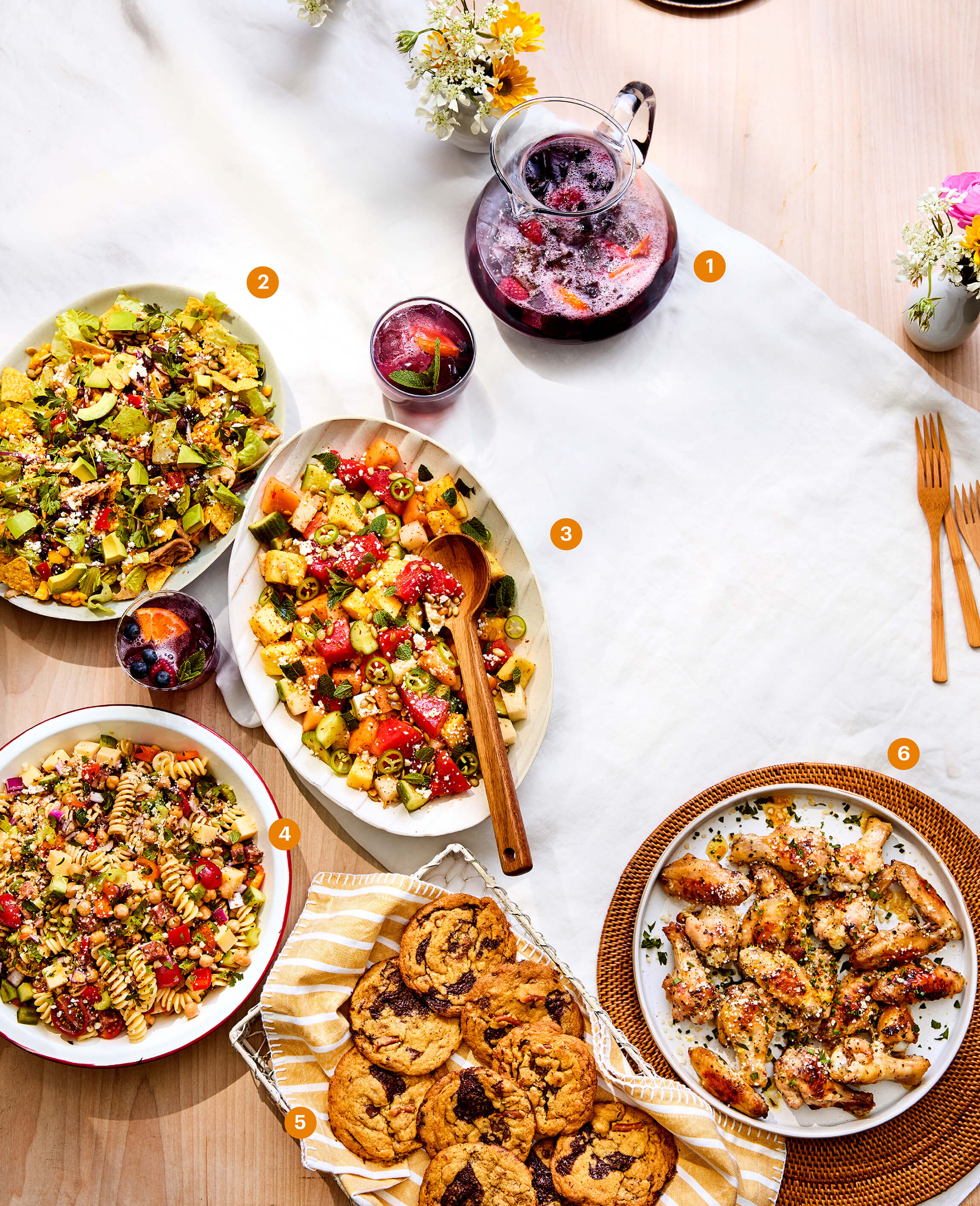 Top view photograph of a table with a spread of food. 