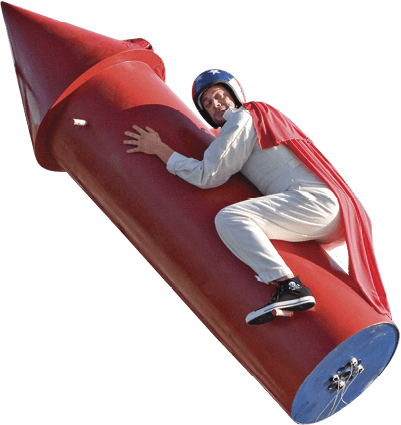 A rocket with a man sitting on it with a red cape 