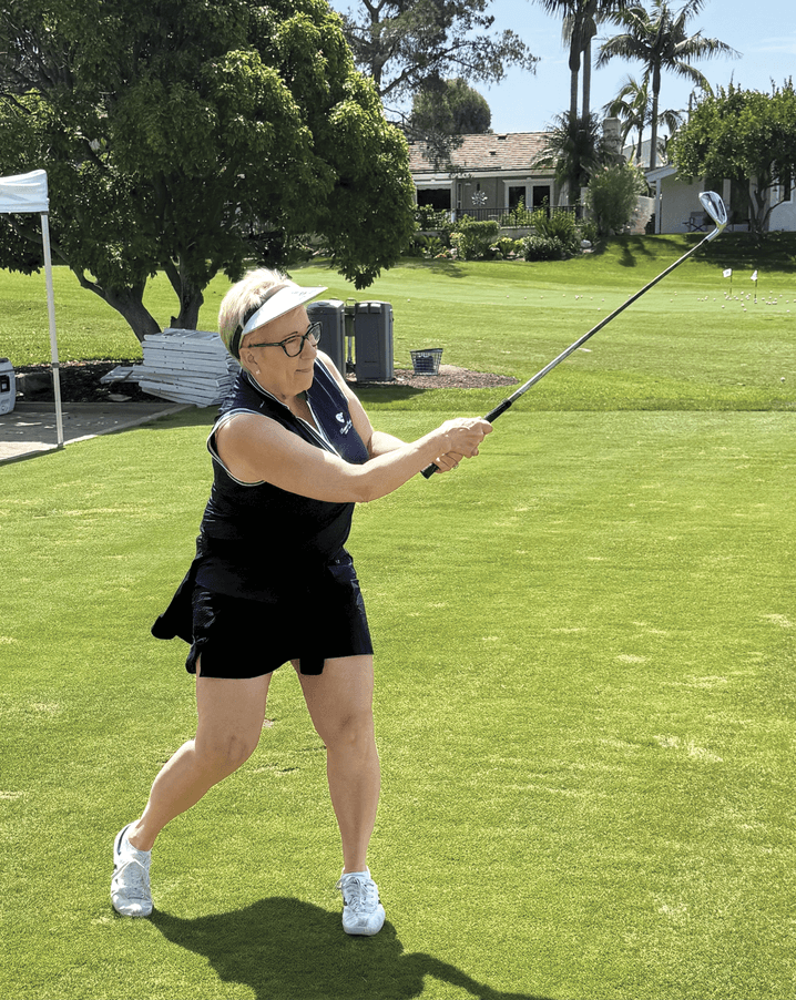 Photograph of Betsy Frost playing golf 