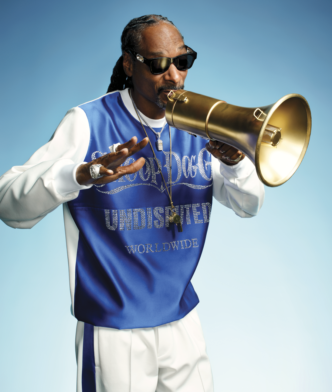 Image of Snoop Dog talking into a microphone 