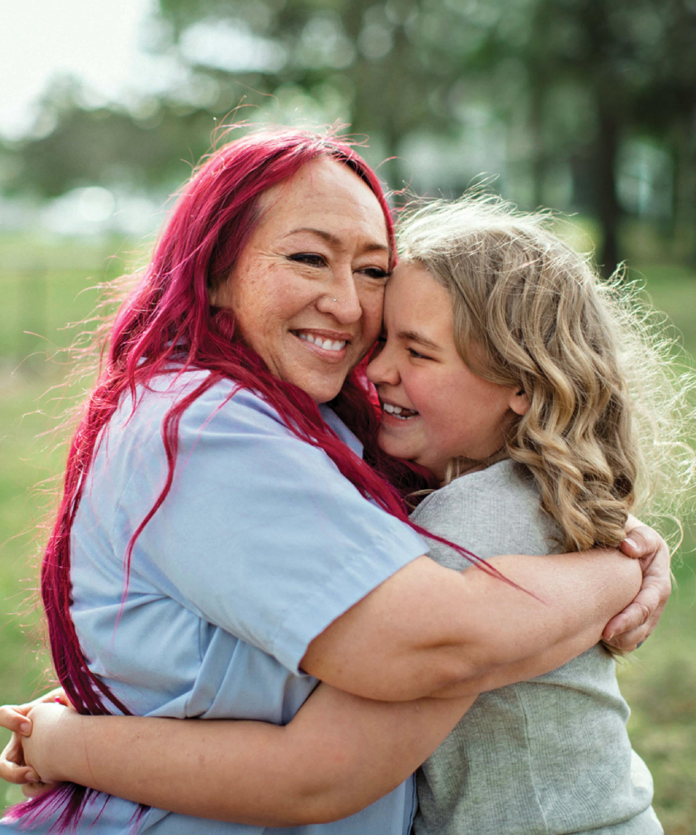 Photograph of Rungphet Bodnar and Chloe Shanks hugging each other