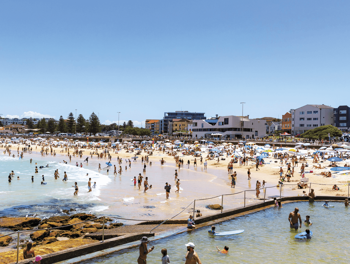Photograph of a beach at Sydney full of people 