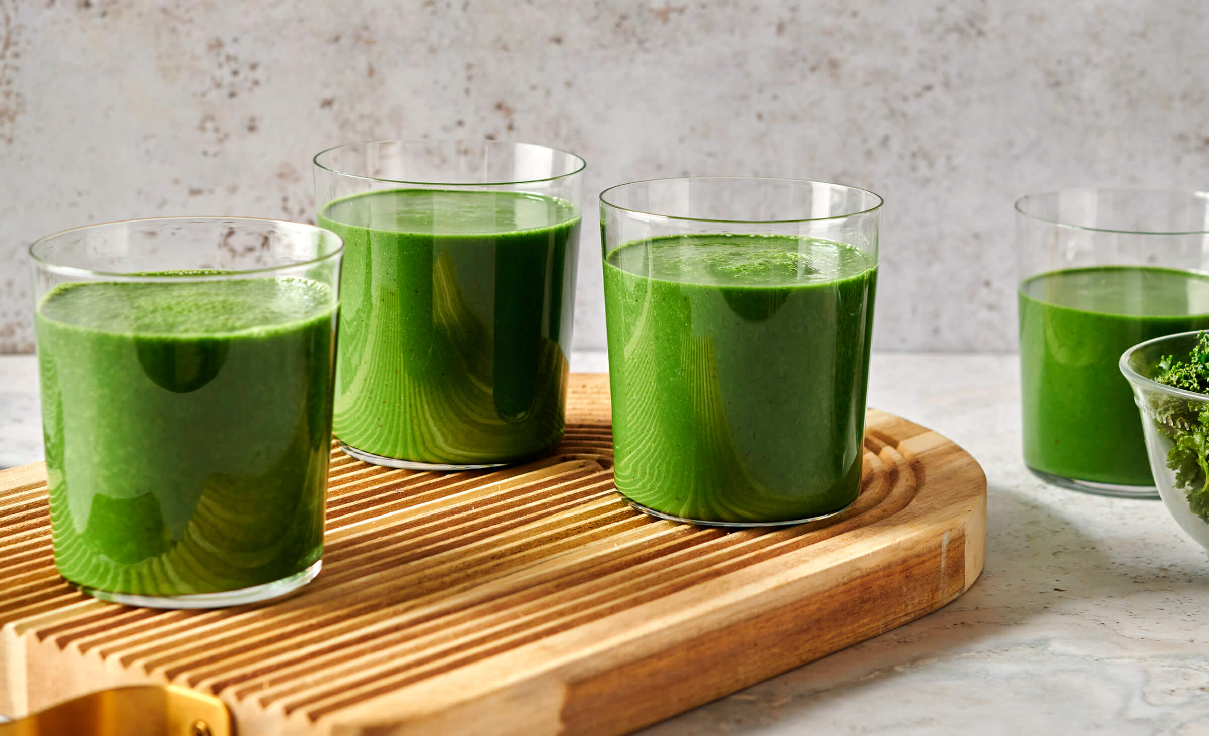 Photo of several glasses of green smoothies