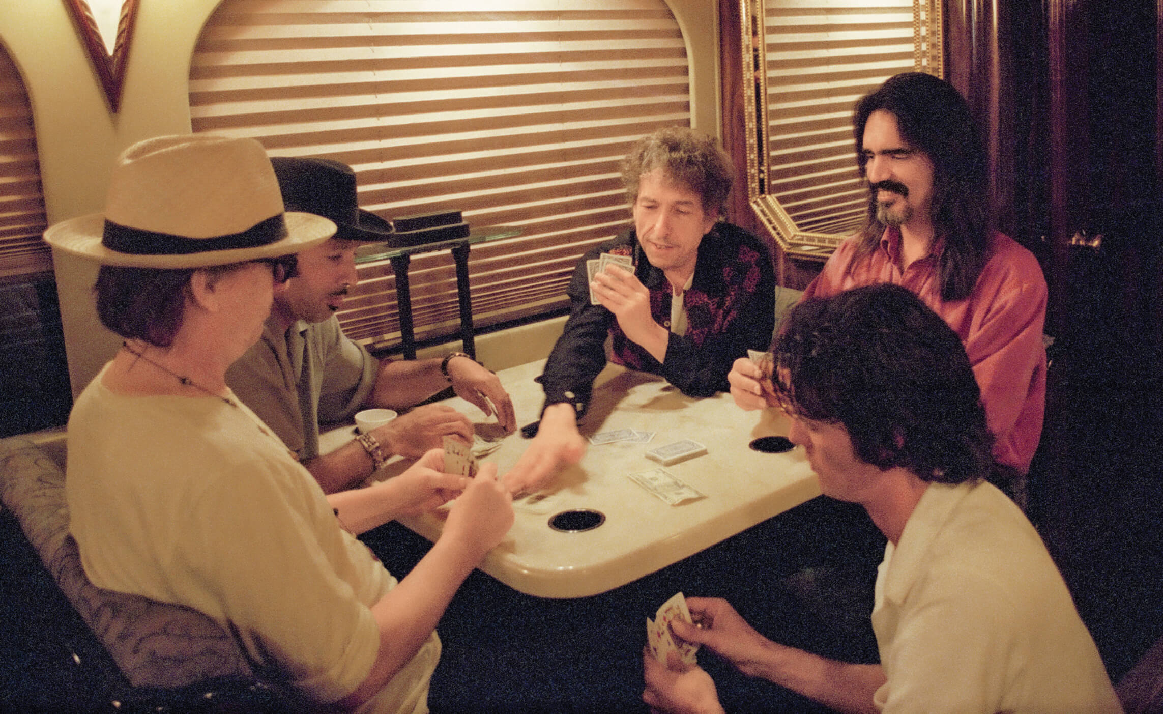 Photo of Bob Dylan on the road in 2001 with David Kemper, Tony Garnier, Larry Campbell and Charlie Sexton