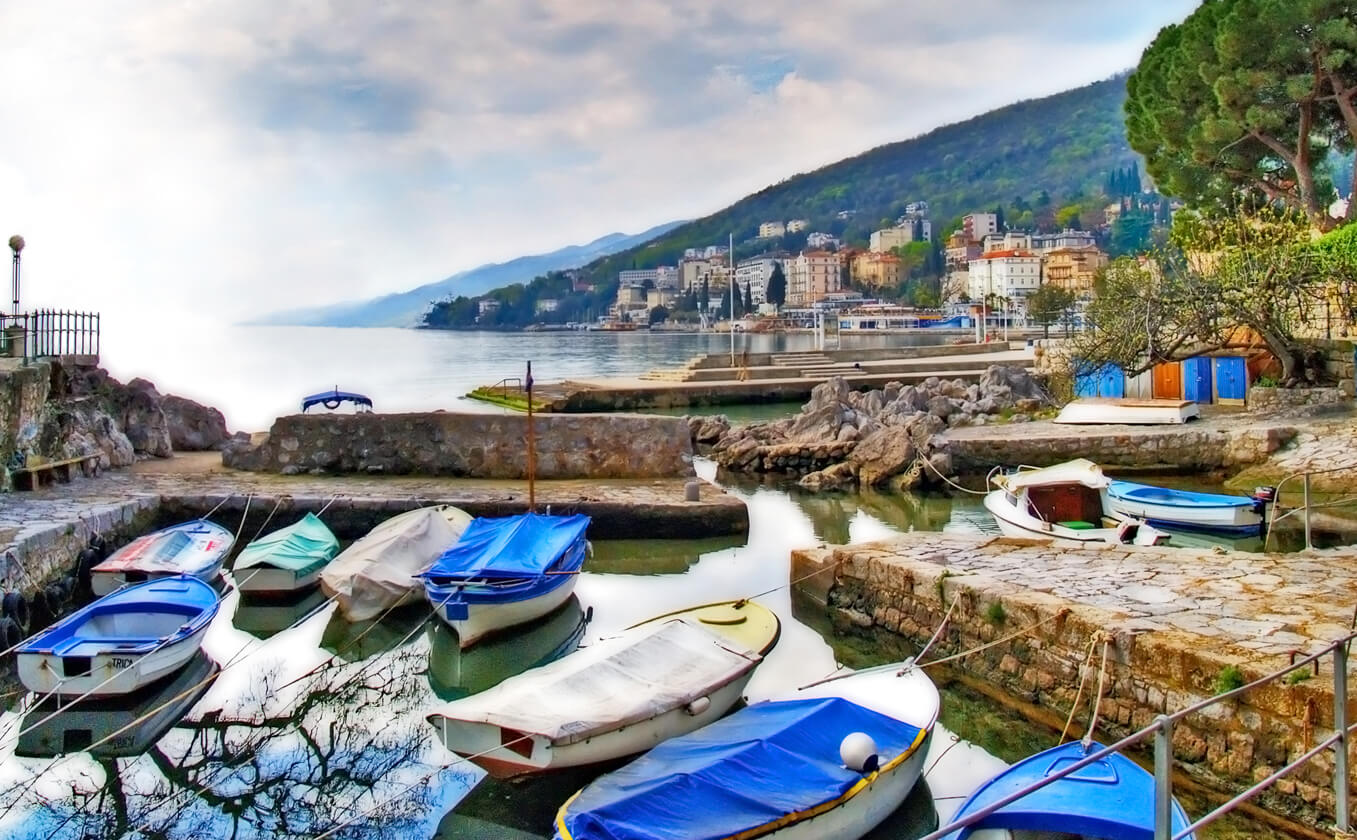 Photo of boats lining a pier in Opatija, Croatia