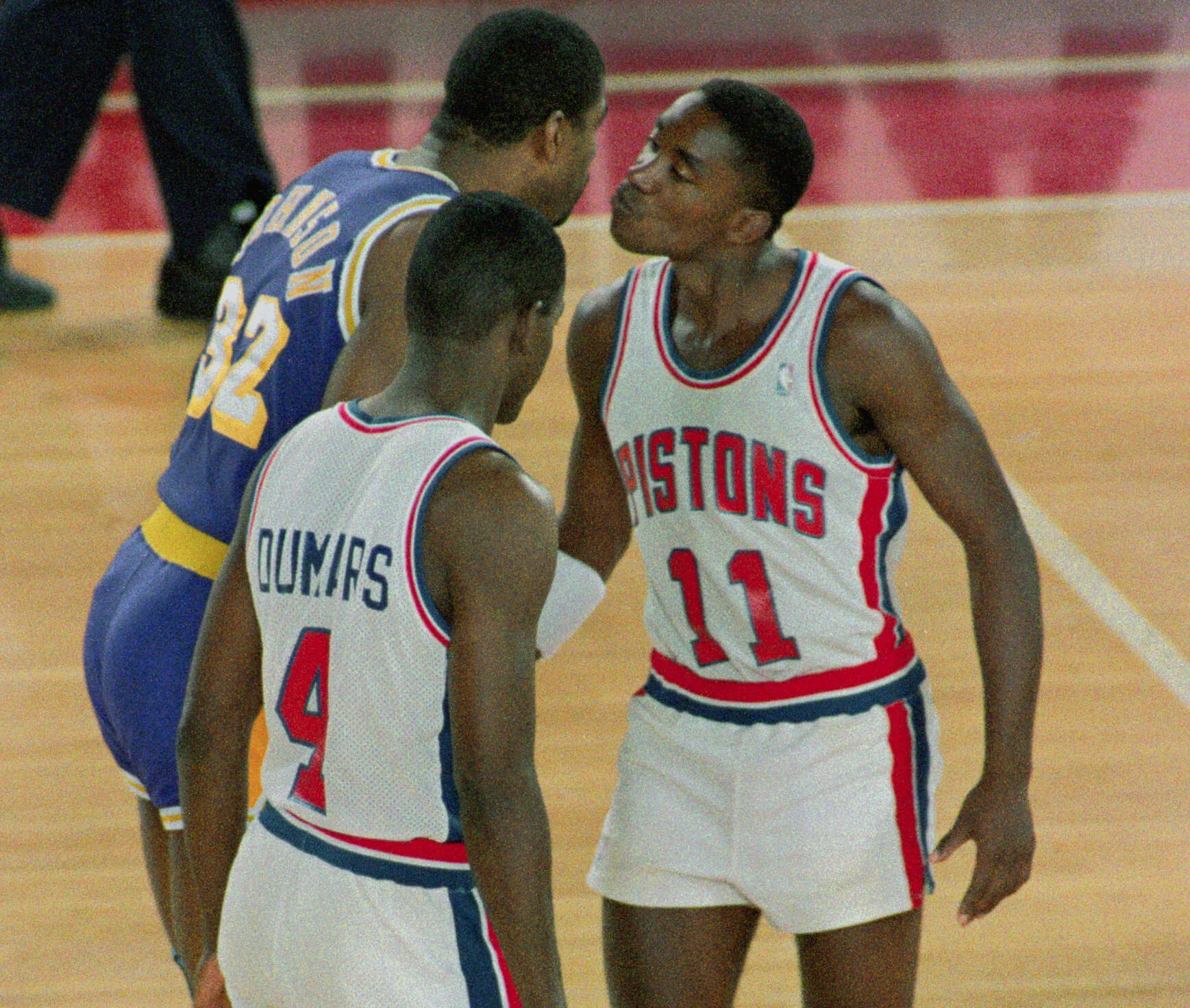 Photo of Magic Johnson and Isiah Thomas having a heated discussion during the 1988 NBA Finals