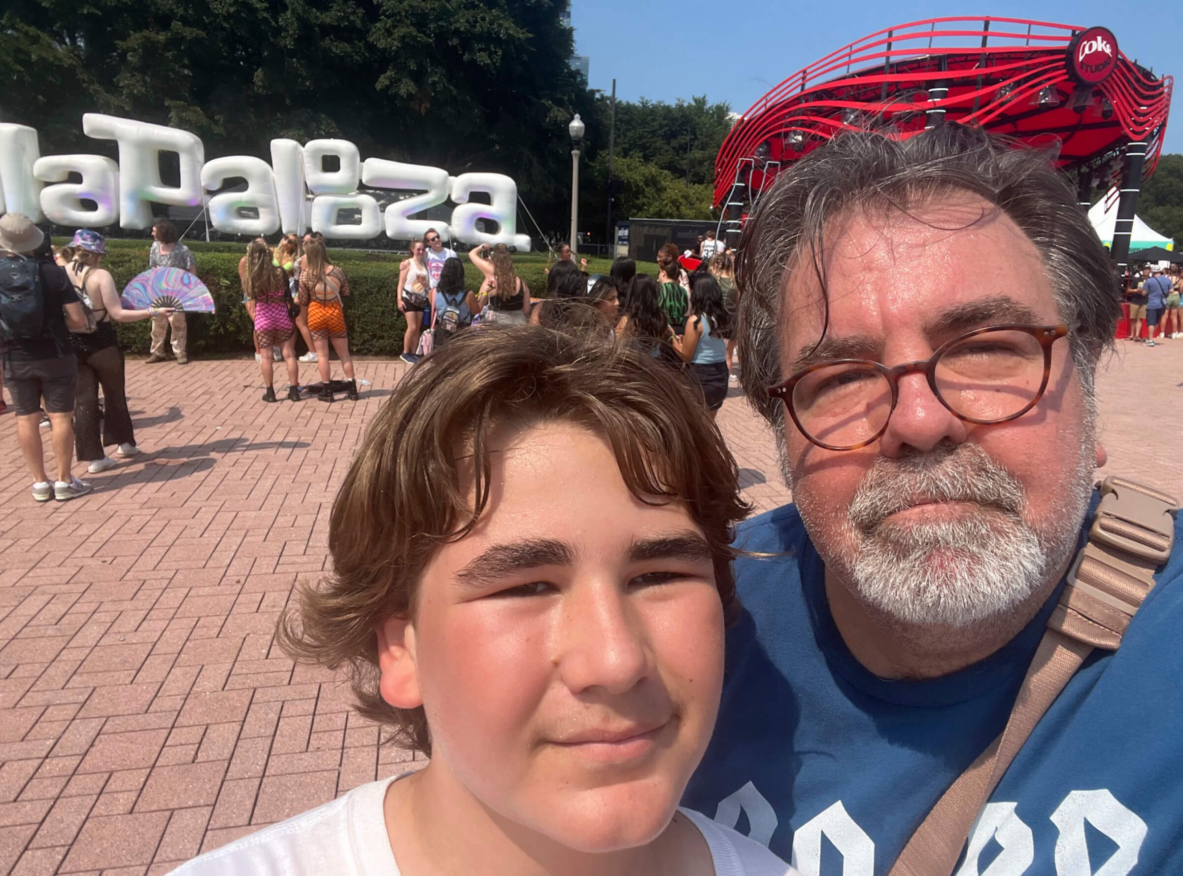 Selfie photo of author Eric Spitznagel and his son Charlie and Lollapalooza