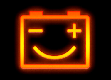 Photo illustration of a glowing car dashboard signal for the battery. The battery icon is winking