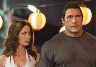 Still of Dwayne Johnson and Emily Blunt in the movie The Smashing Machine