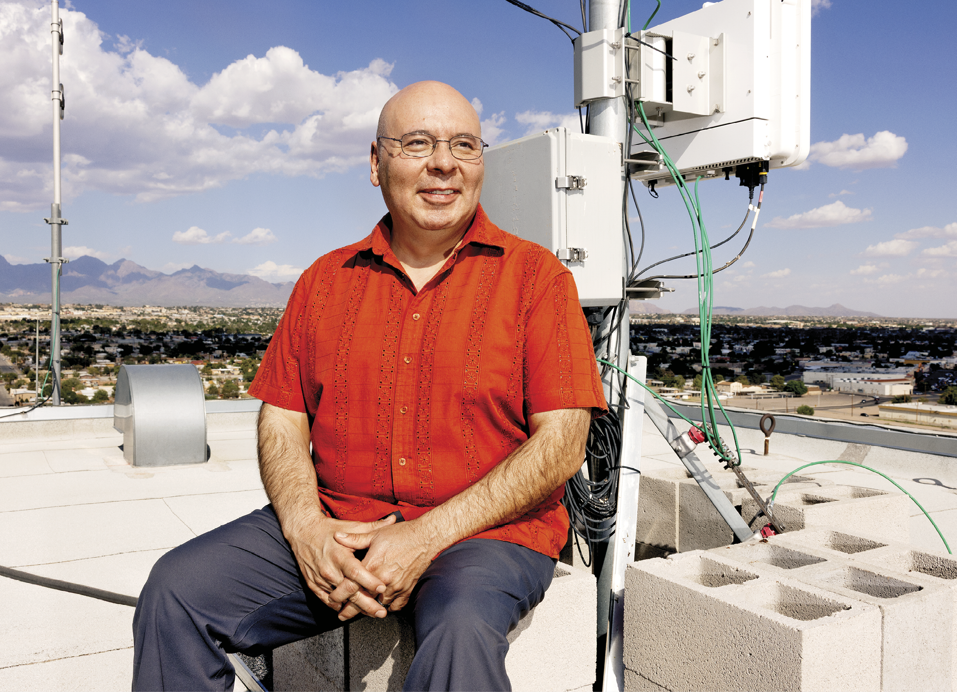Image of Aaron Casillas sitting on a rooftop
